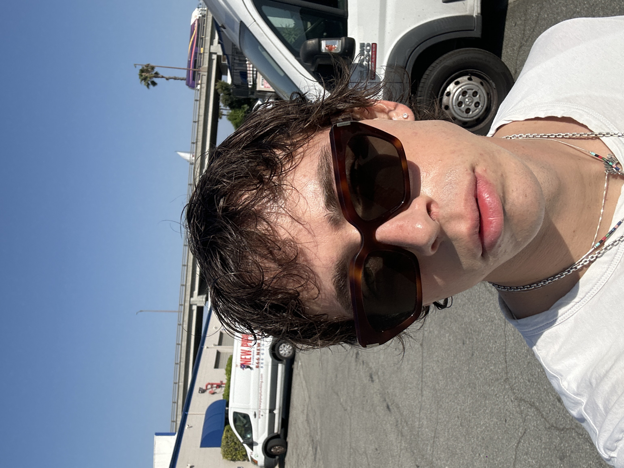 Person photographed smoking cigarette in Glendale parking lot