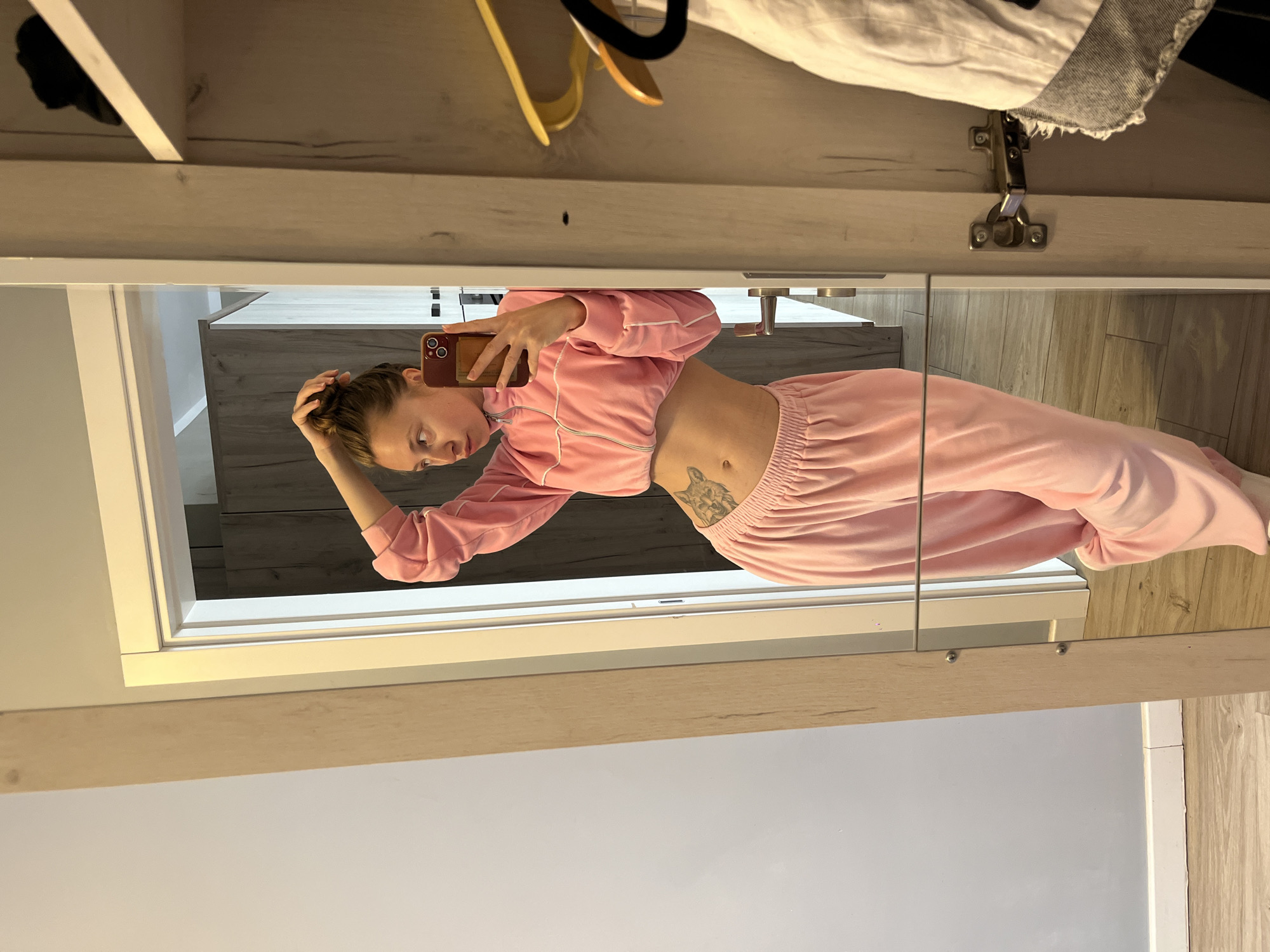Woman takes morning selfies in pink tracksuit, Montenegro
