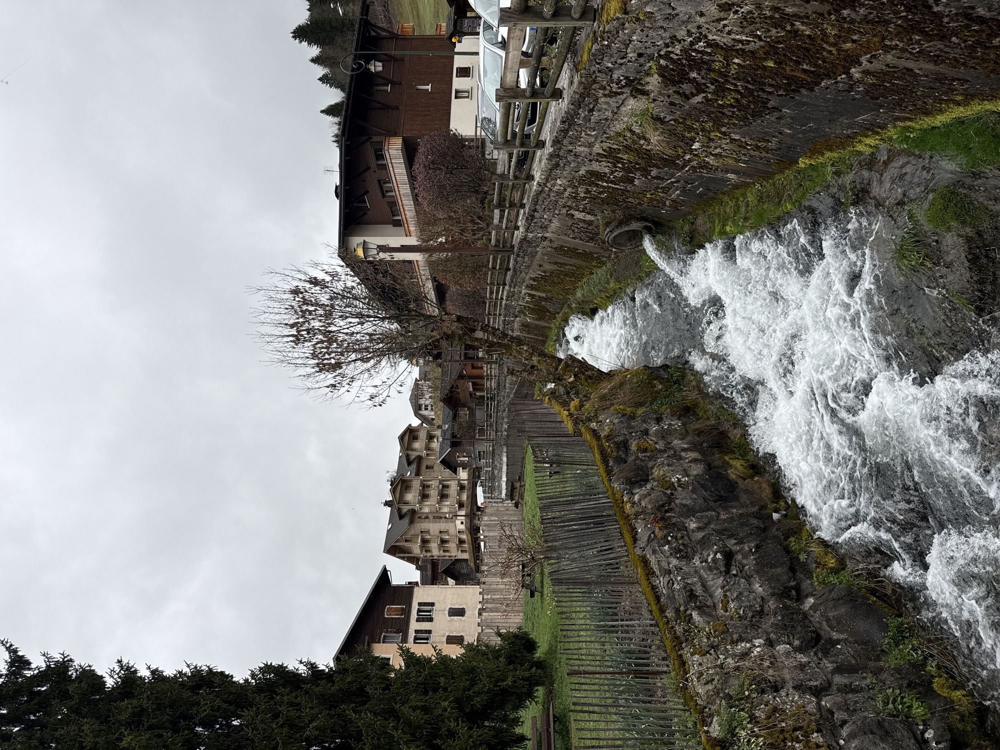 Morning scenes captured in La Clusaz: waterfall and church spire