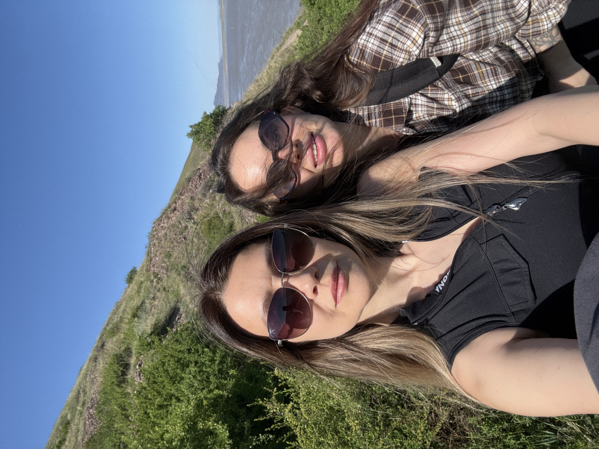 Two women enjoy sunny morning outing in Ust-Abakan countryside