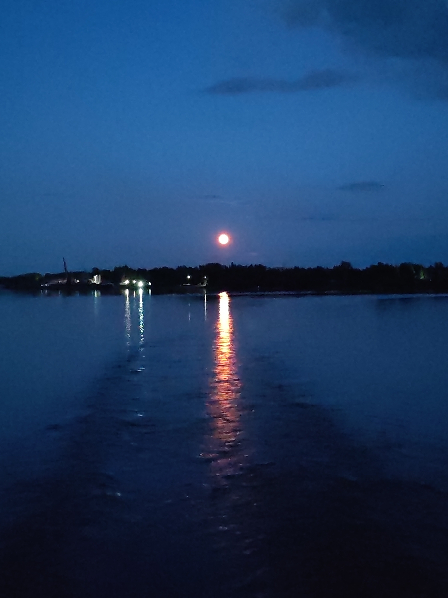 Twilight to moonlit night along the water in rural Russia