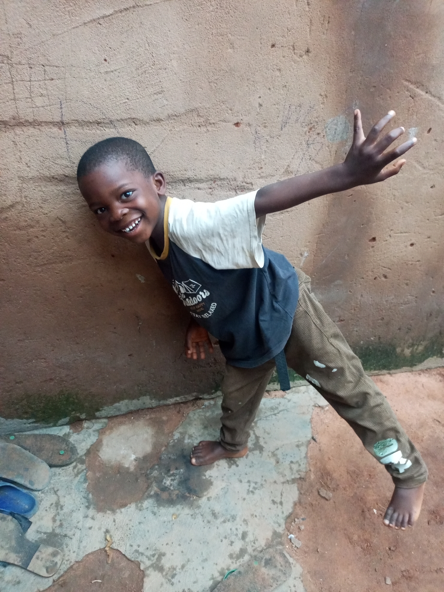Morning street life in a residential neighborhood in Tumfure, Nigeria