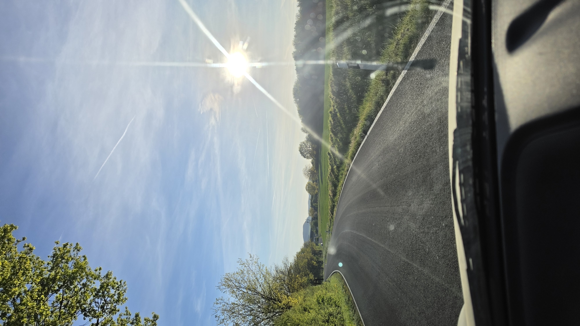 Driver captures sunlit countryside view on German roadway