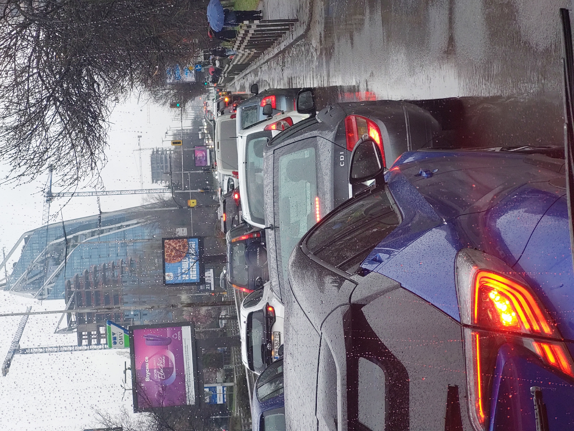 Heavy traffic jams grip wet city streets during rainfall
