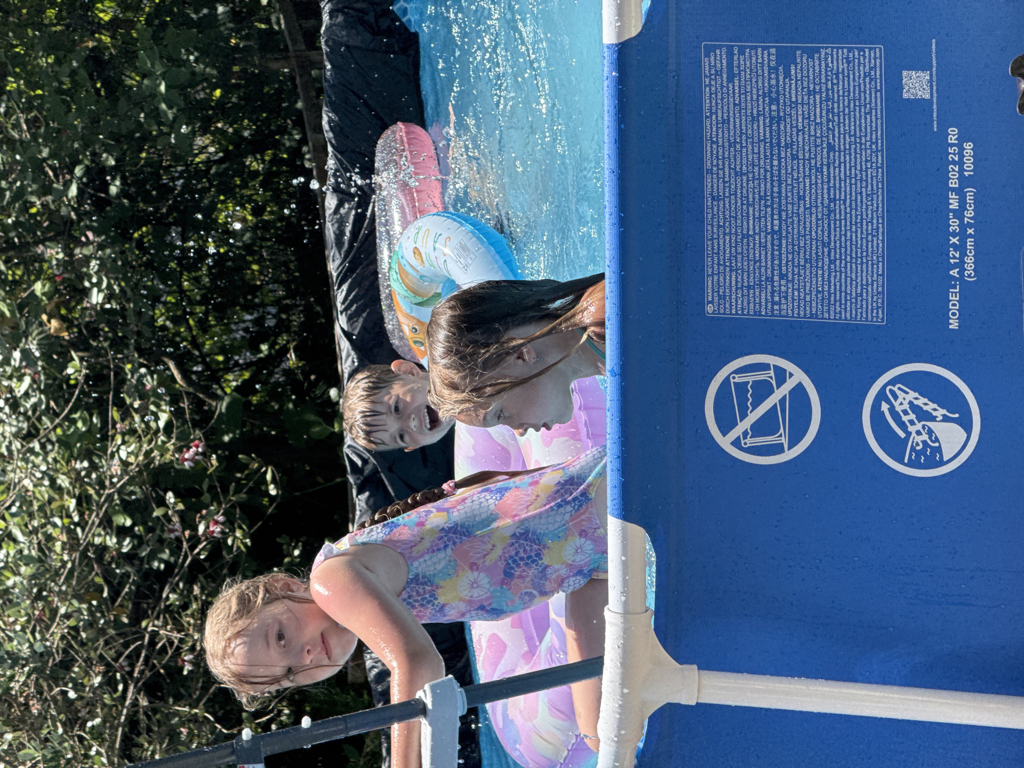 Kids' pool day in a Sochi backyard, summer morning