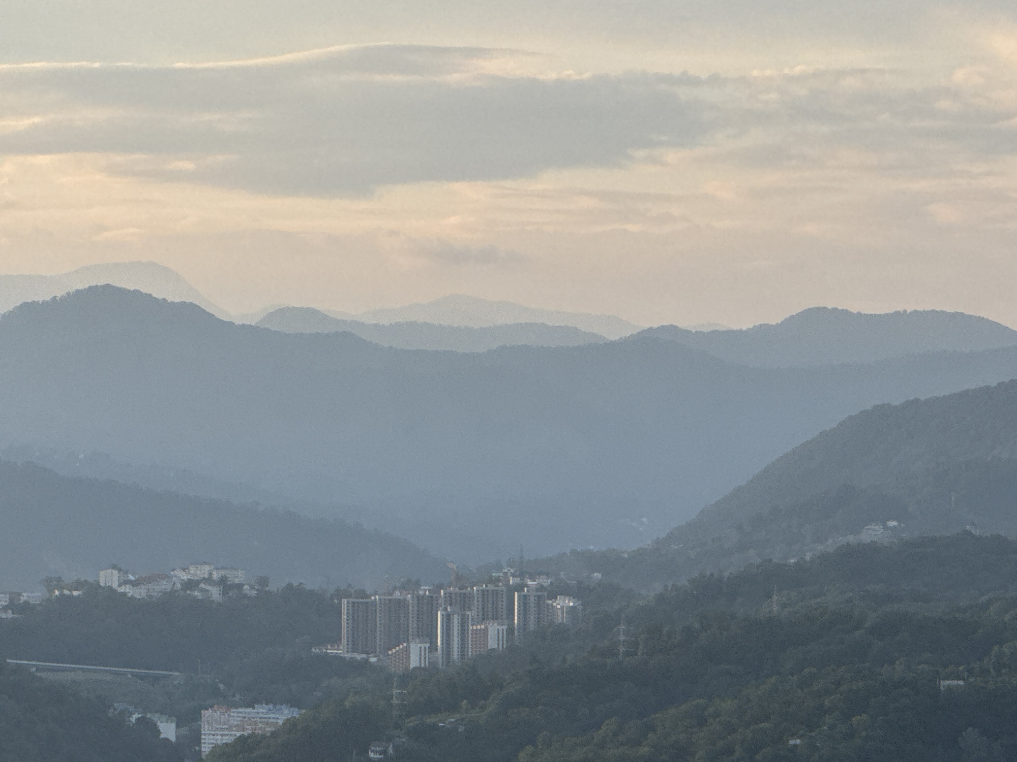 Evening views across Sochi's hillside neighborhoods and valleys