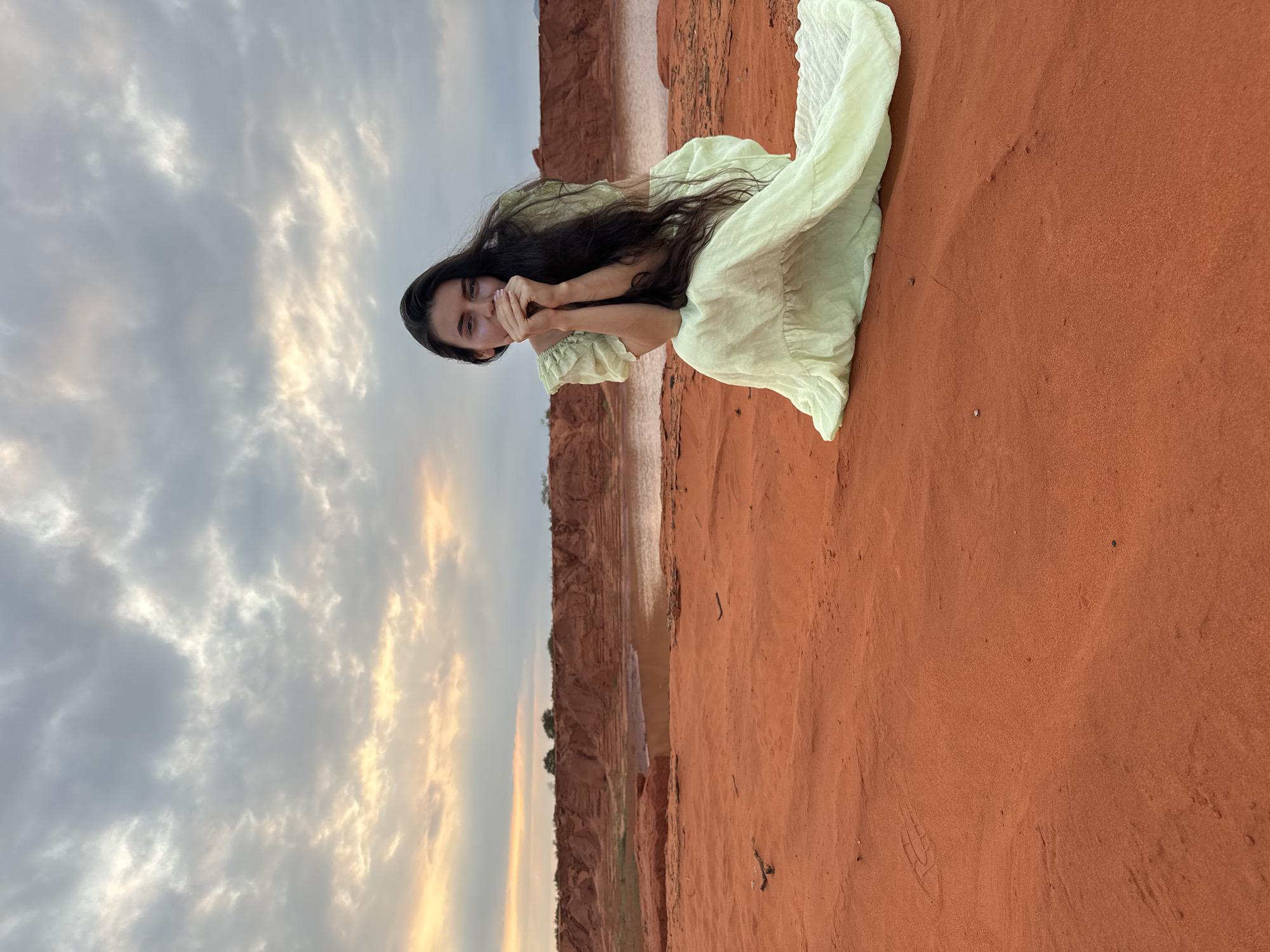 Woman poses for photos at Mui Ne sand dunes