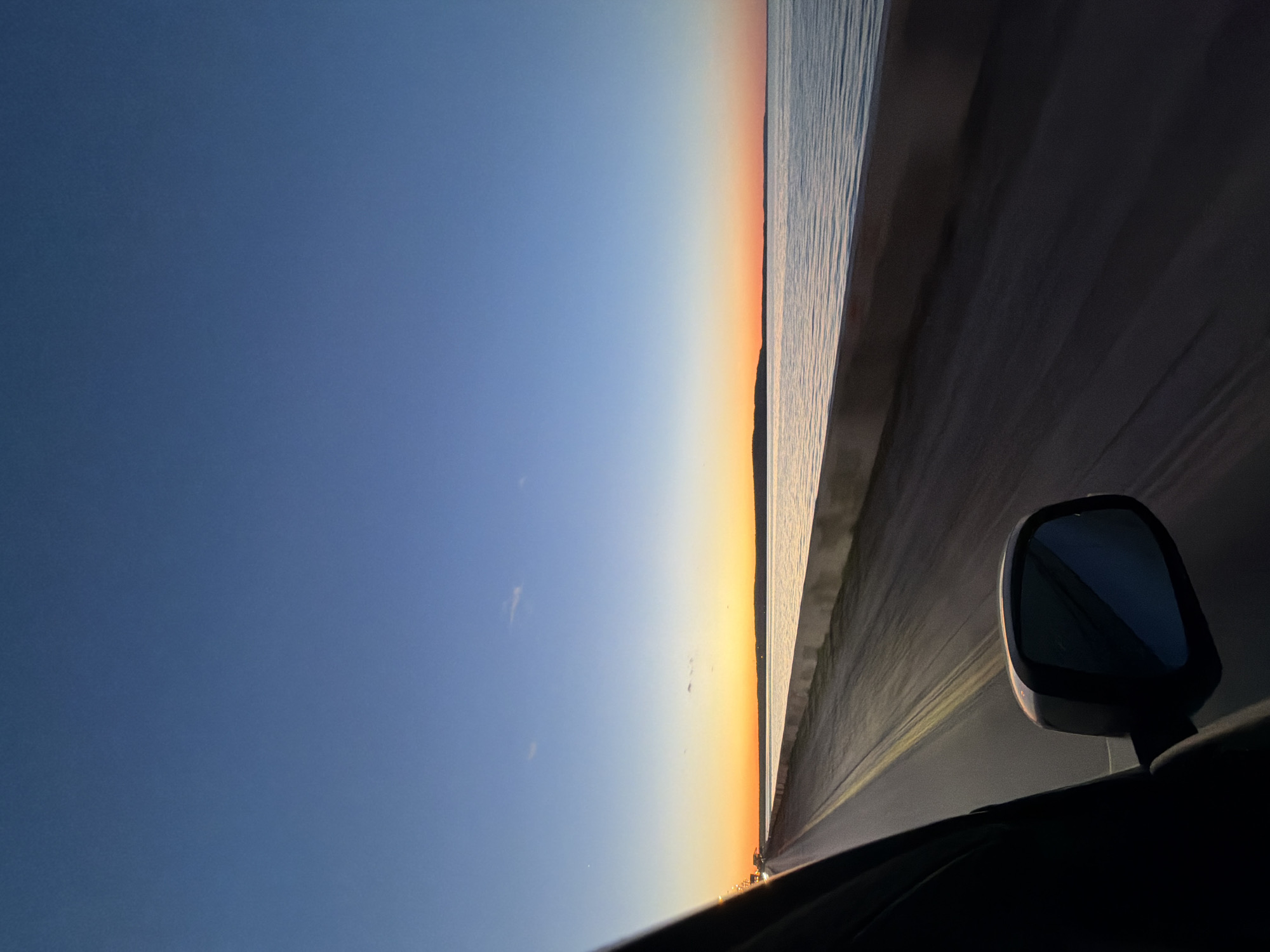 Driver captures sunset views during evening drive in Chaikovsky