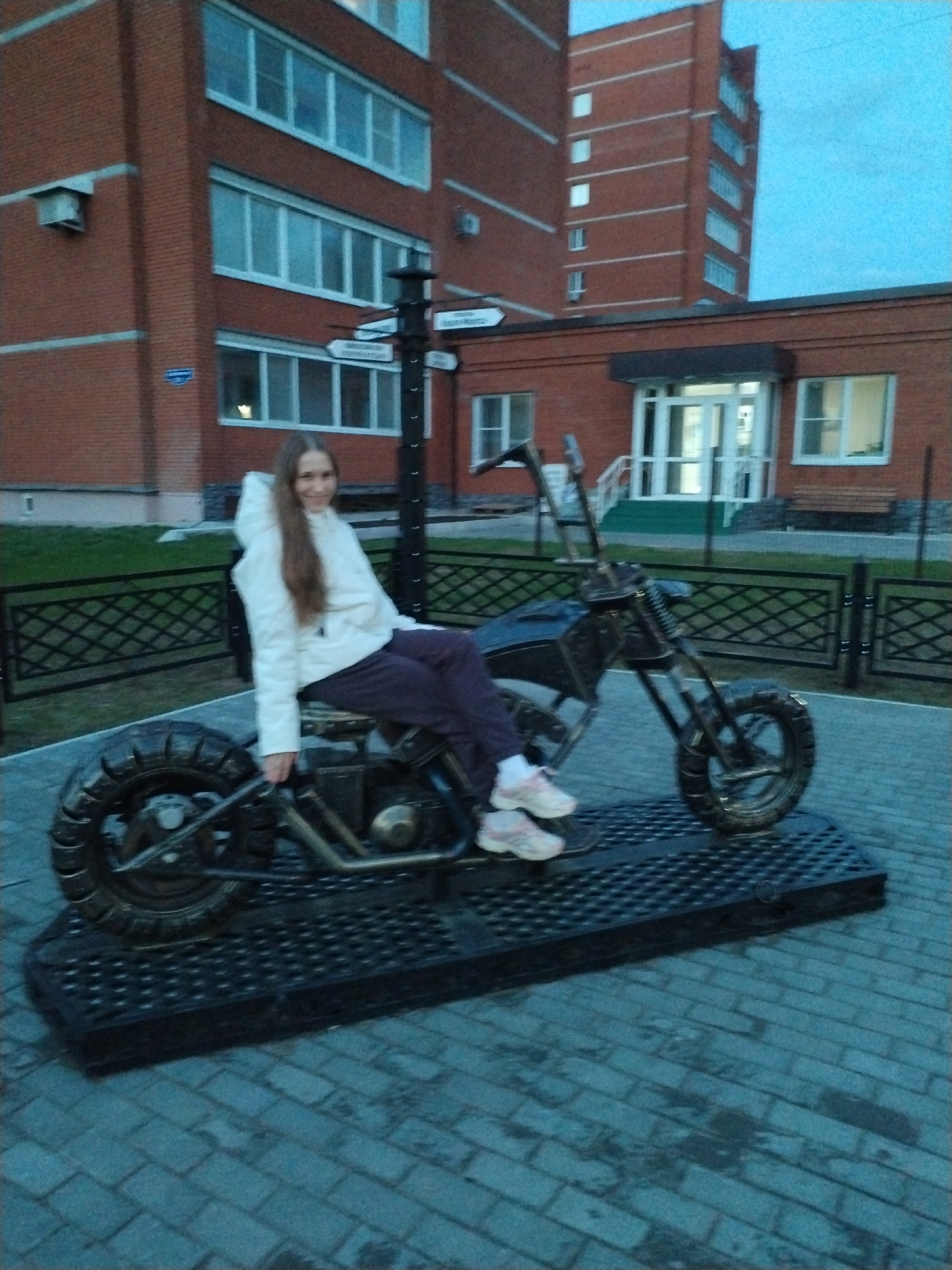 Woman exercises at outdoor park equipment in Chaikovsky