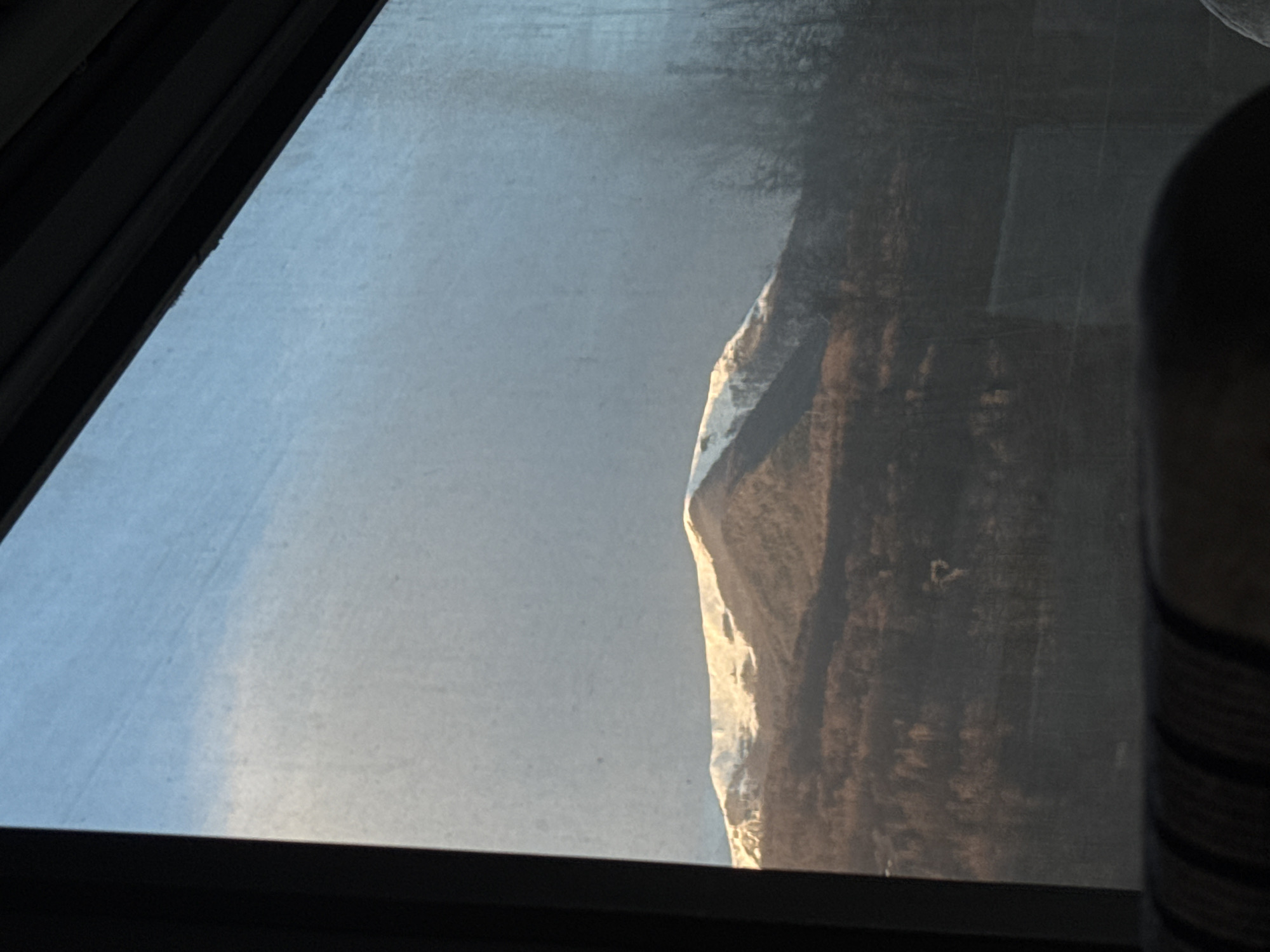 Mountain view with snow captured through window in Montenegro
