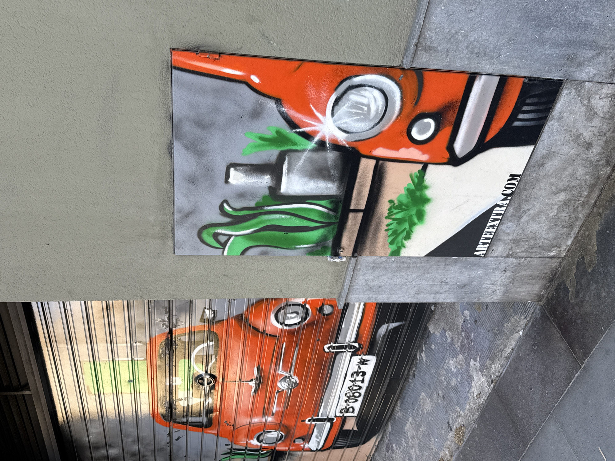 Orange vehicle graffiti art documented on Barcelona metal surfaces