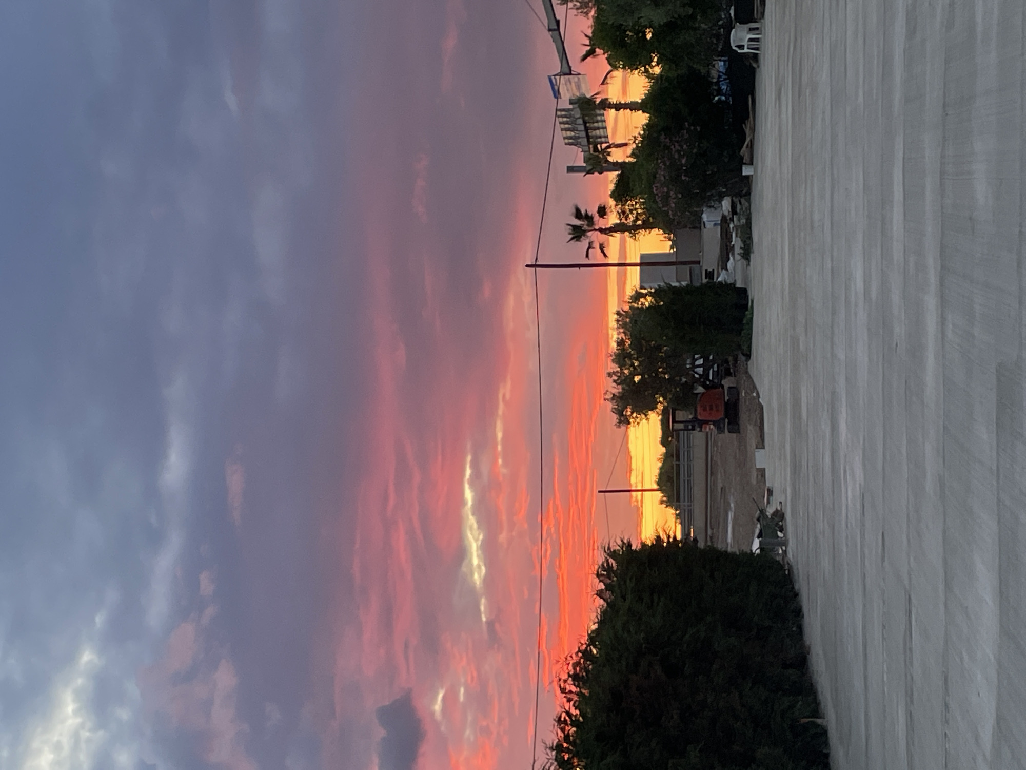 Sunset views and sleeping bulldog captured in Πόρτες, Greece