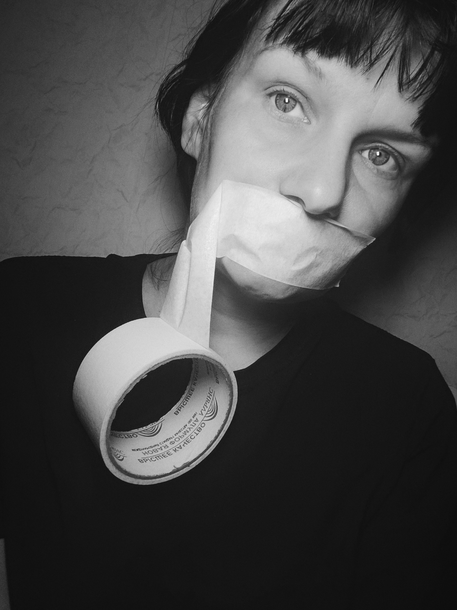 Woman photographed with tape over mouth in Foki, Russia