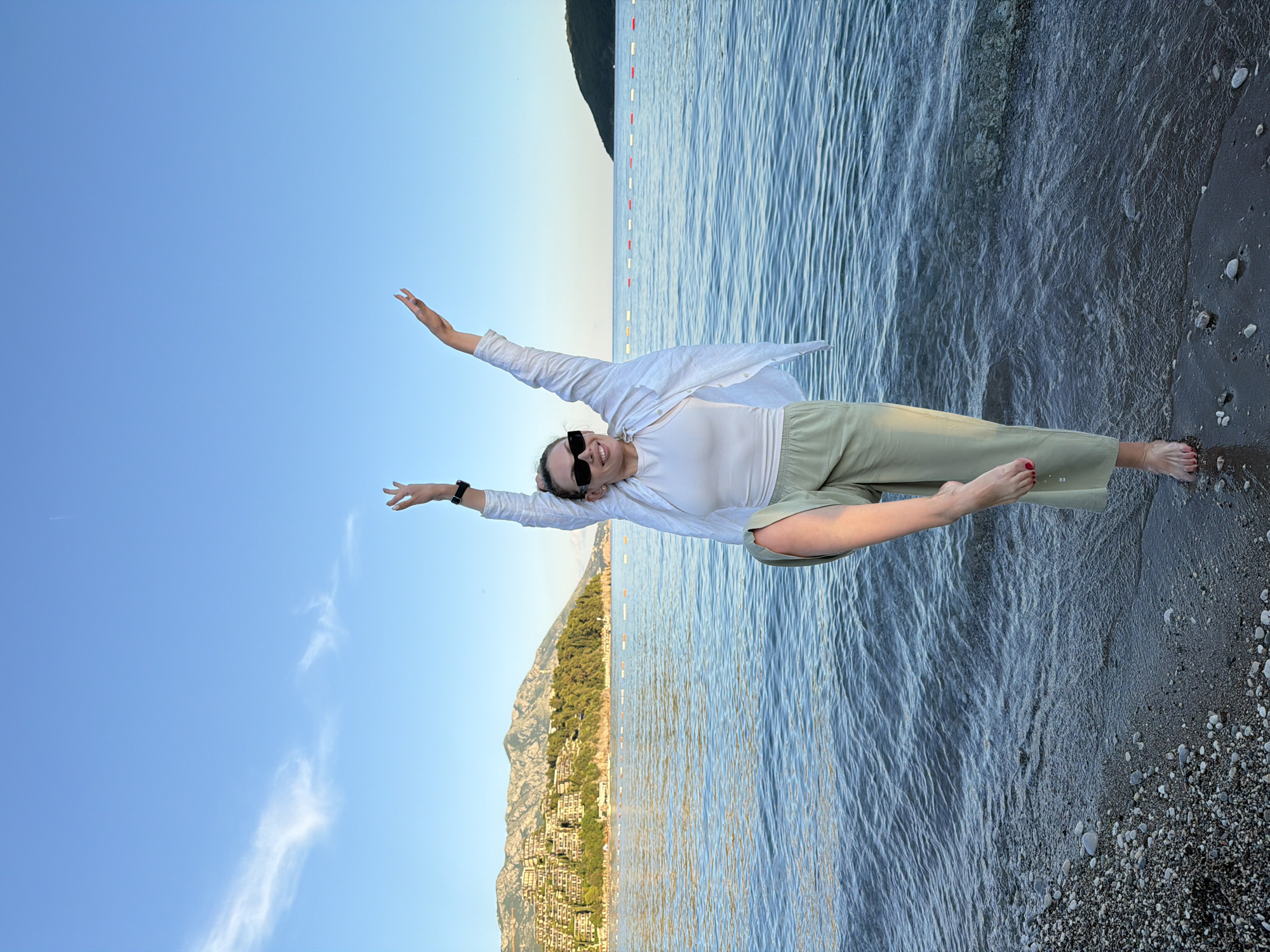 Woman photographed at Budva beach during summer afternoon