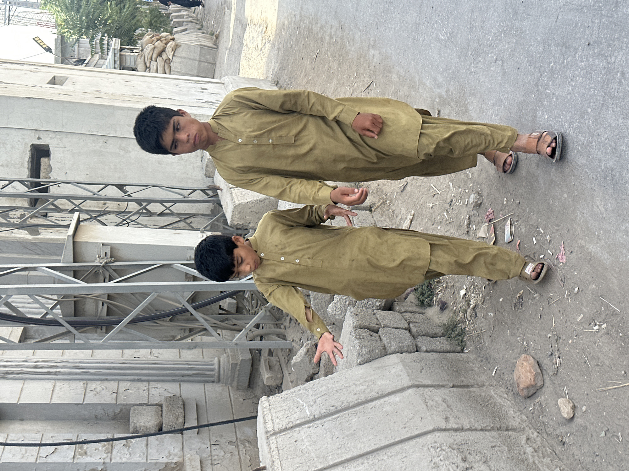 Street scene with pedestrians and motorcycle in Quetta