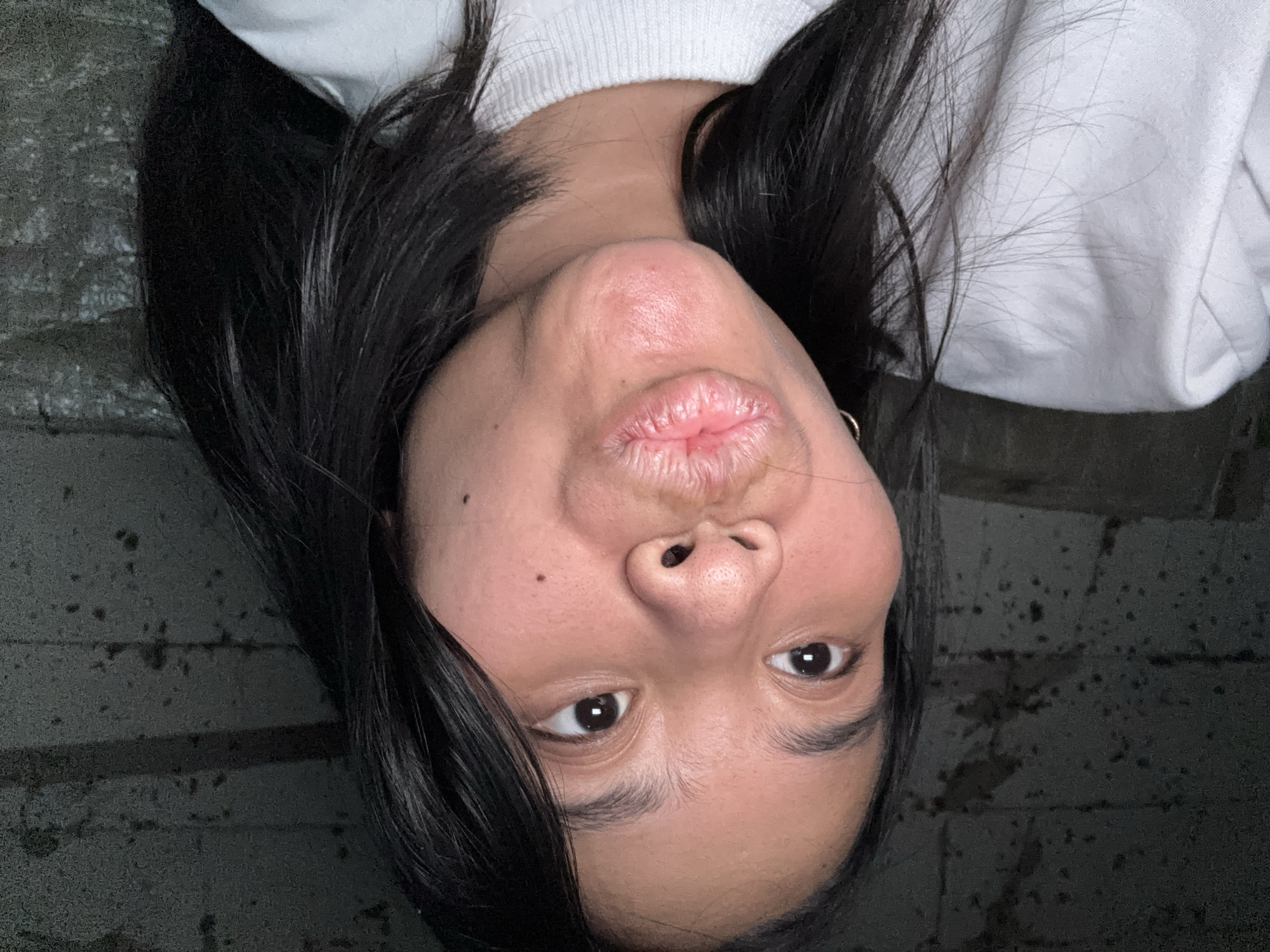Playful selfie session in East Jakarta bedroom