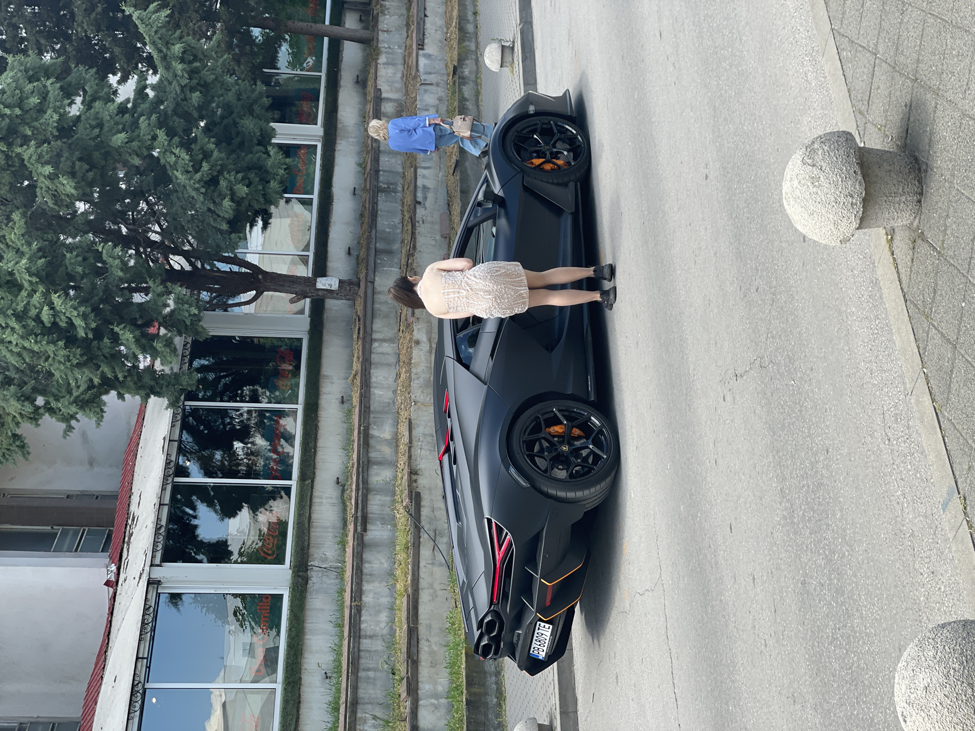 Woman poses with Lamborghini on Pazardzhik street