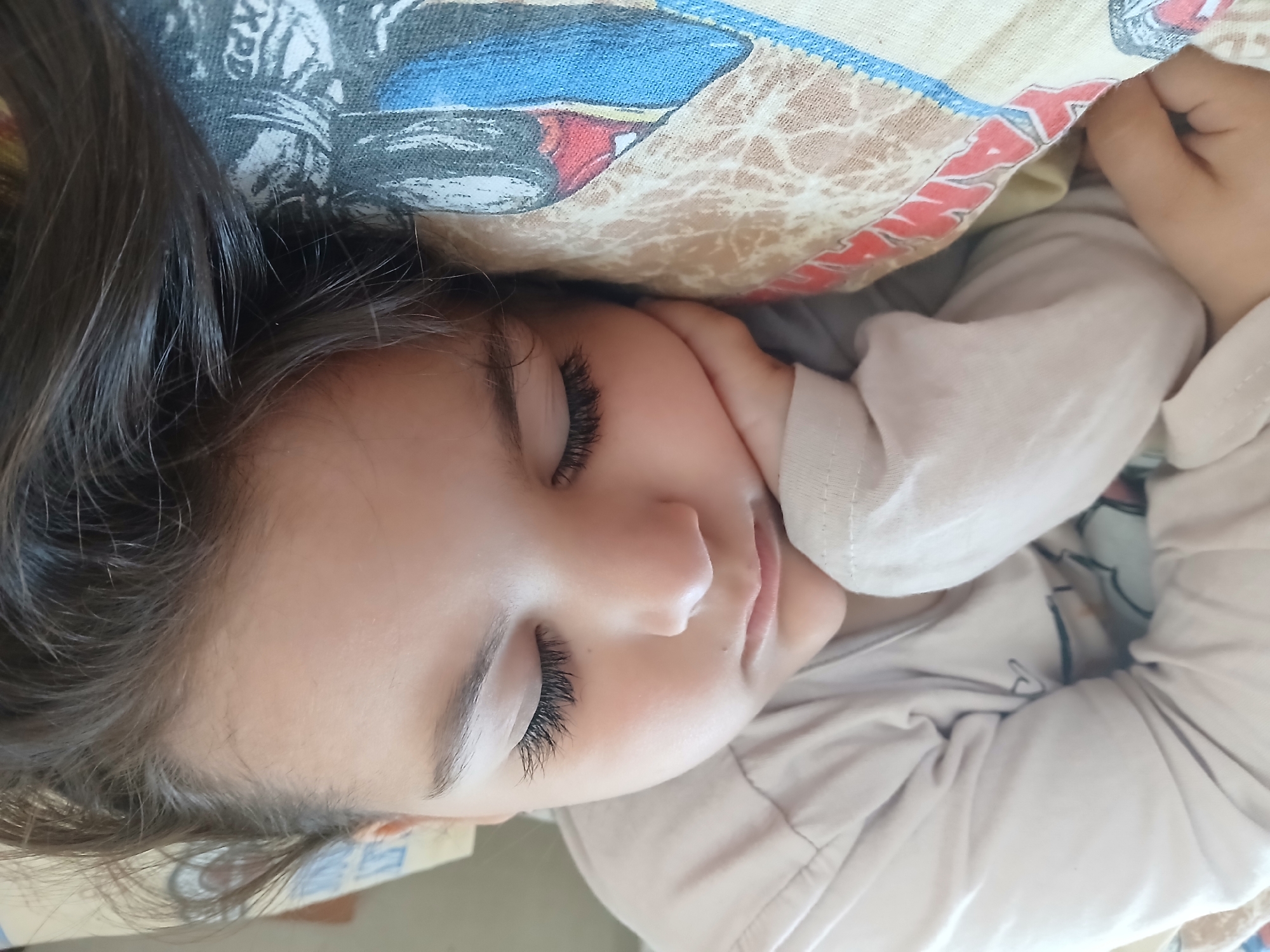 Mother and child rest together in Bulgarian home
