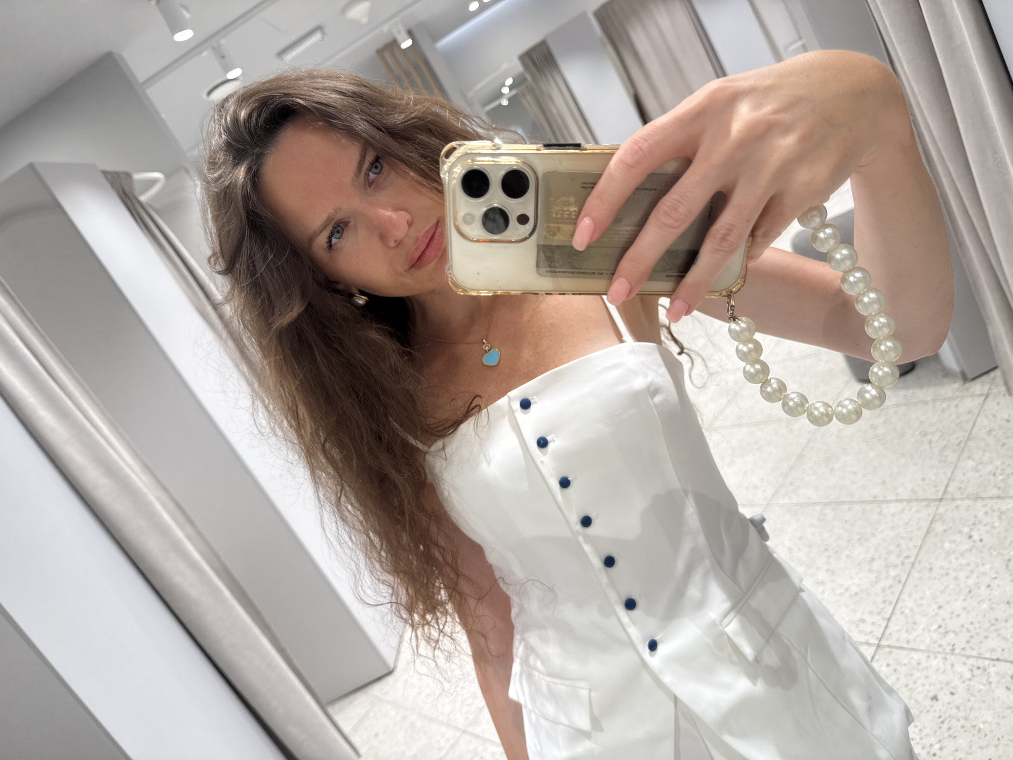Fitting room try-on selfies in a Moscow clothing store