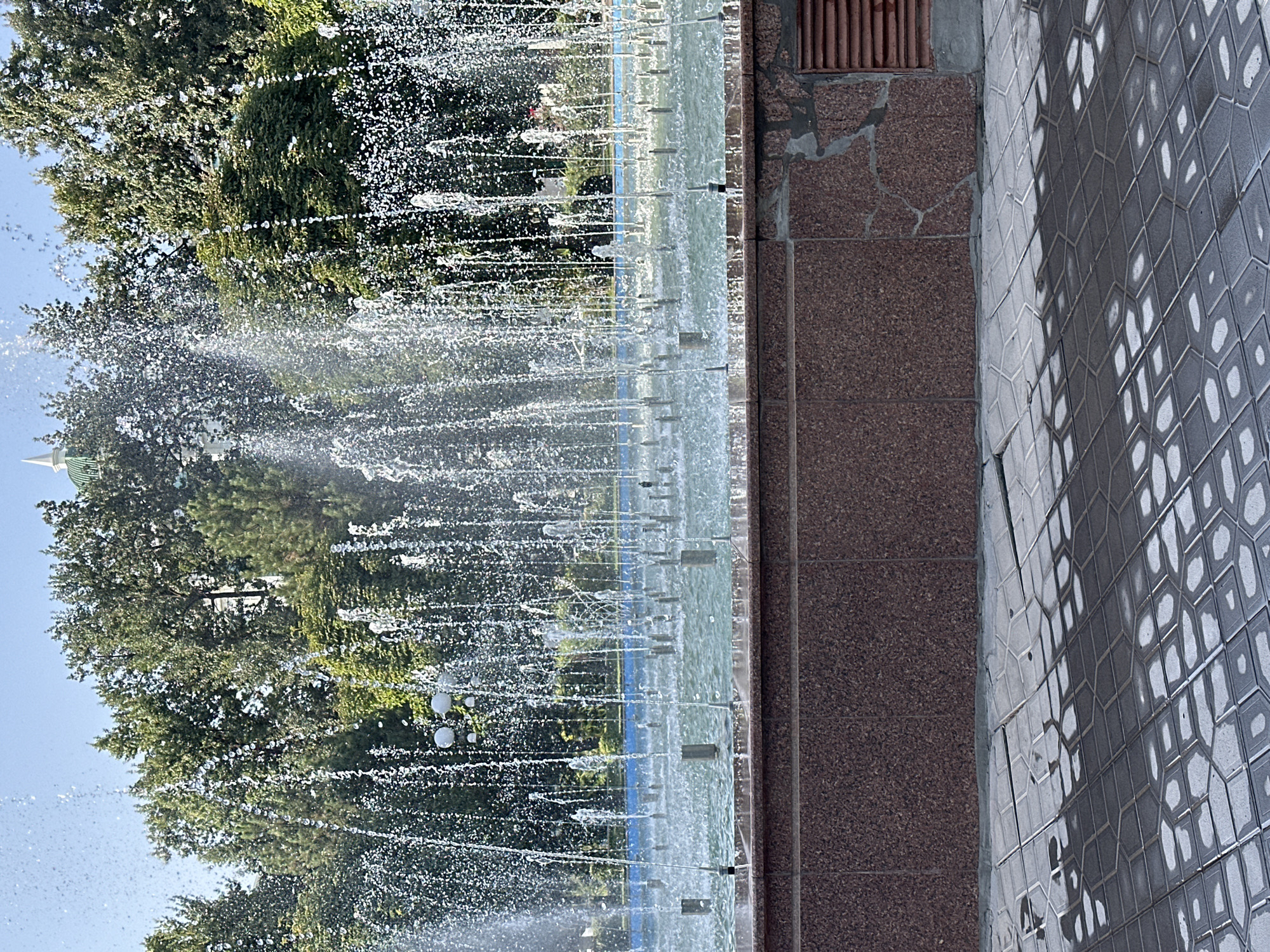 Afternoon at a busy fountain in a Tashkent city park
