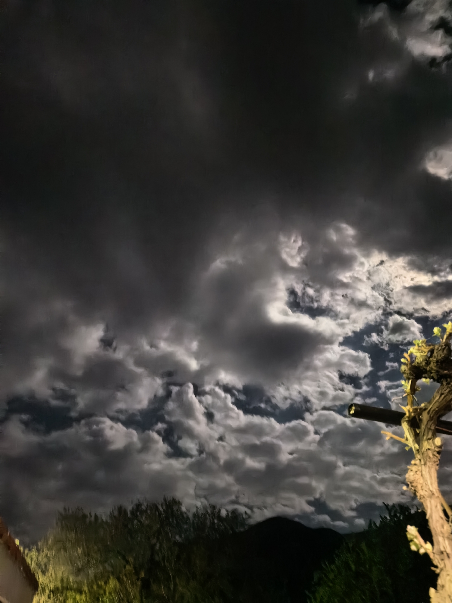 Dramatic storm clouds illuminate night sky over Sapareva Banya