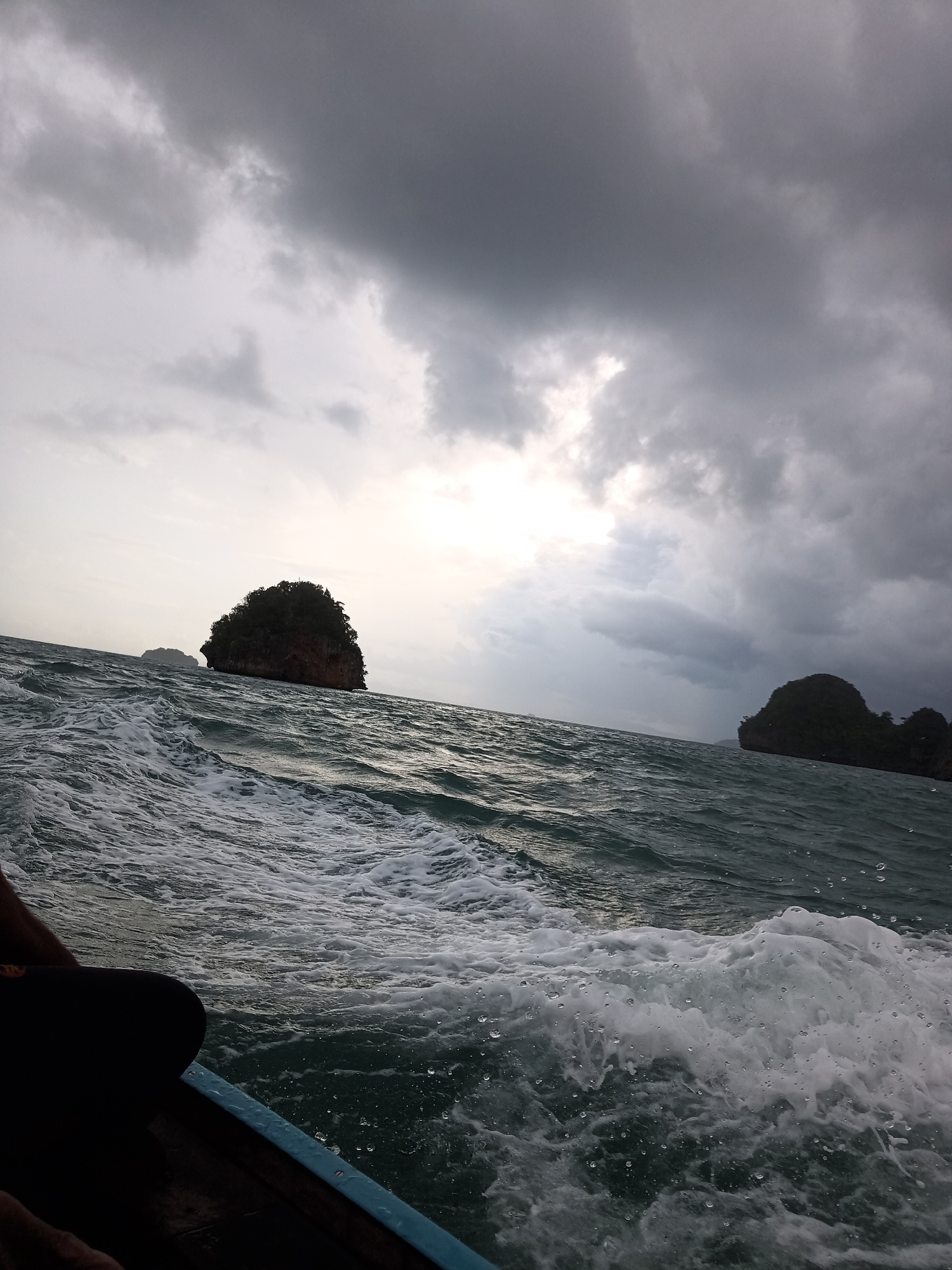 Boat encounters rough seas under storm clouds off Thailand