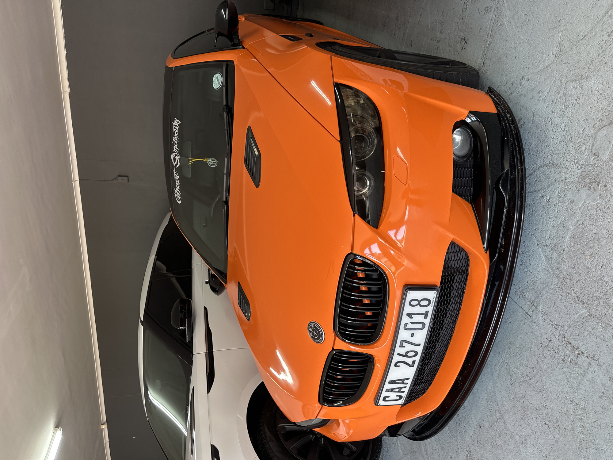 Orange BMW with Ghost Syndicate markings spotted in Cape Town garage