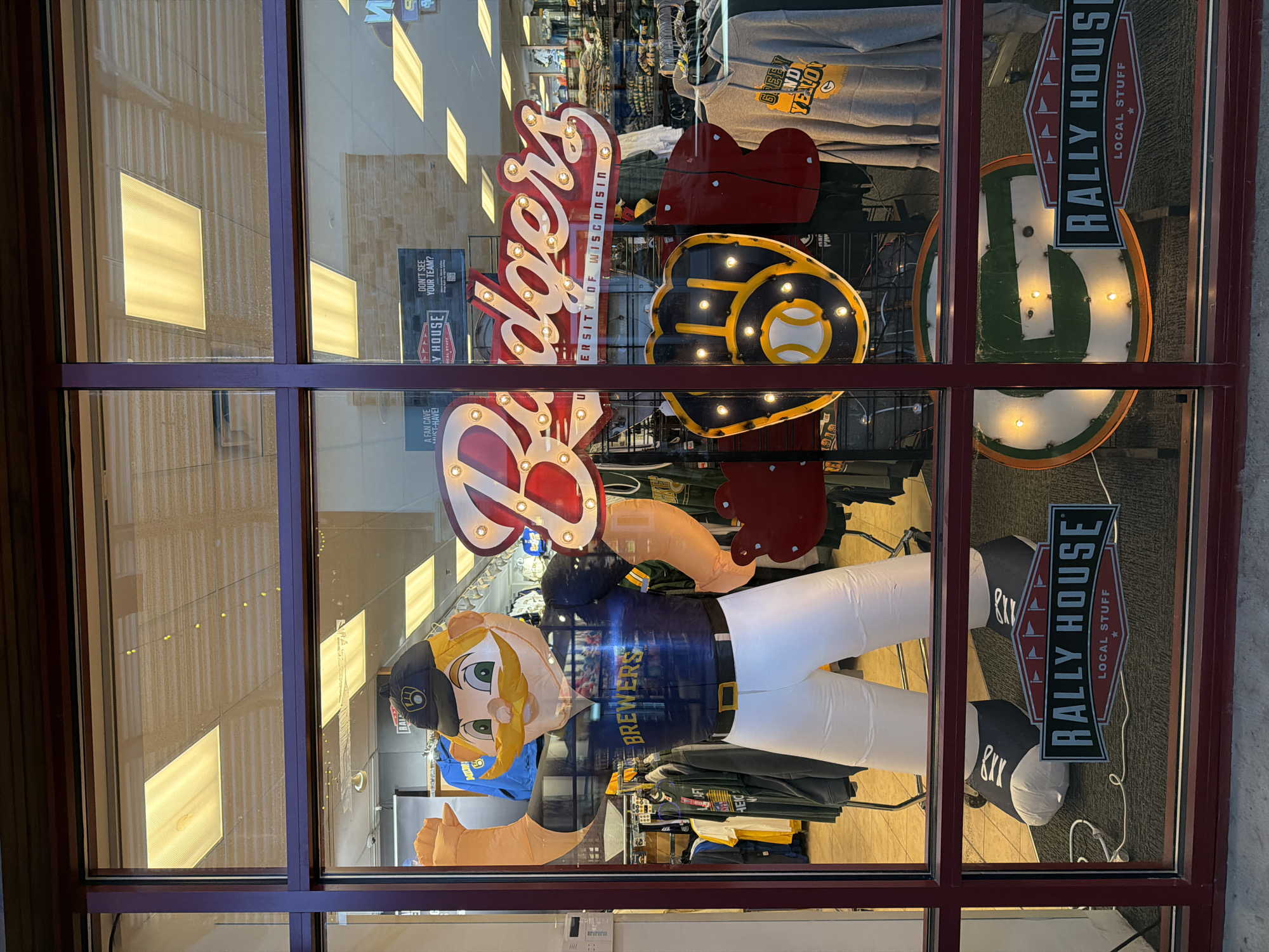 Sports retailer window display documented in Baraboo mall