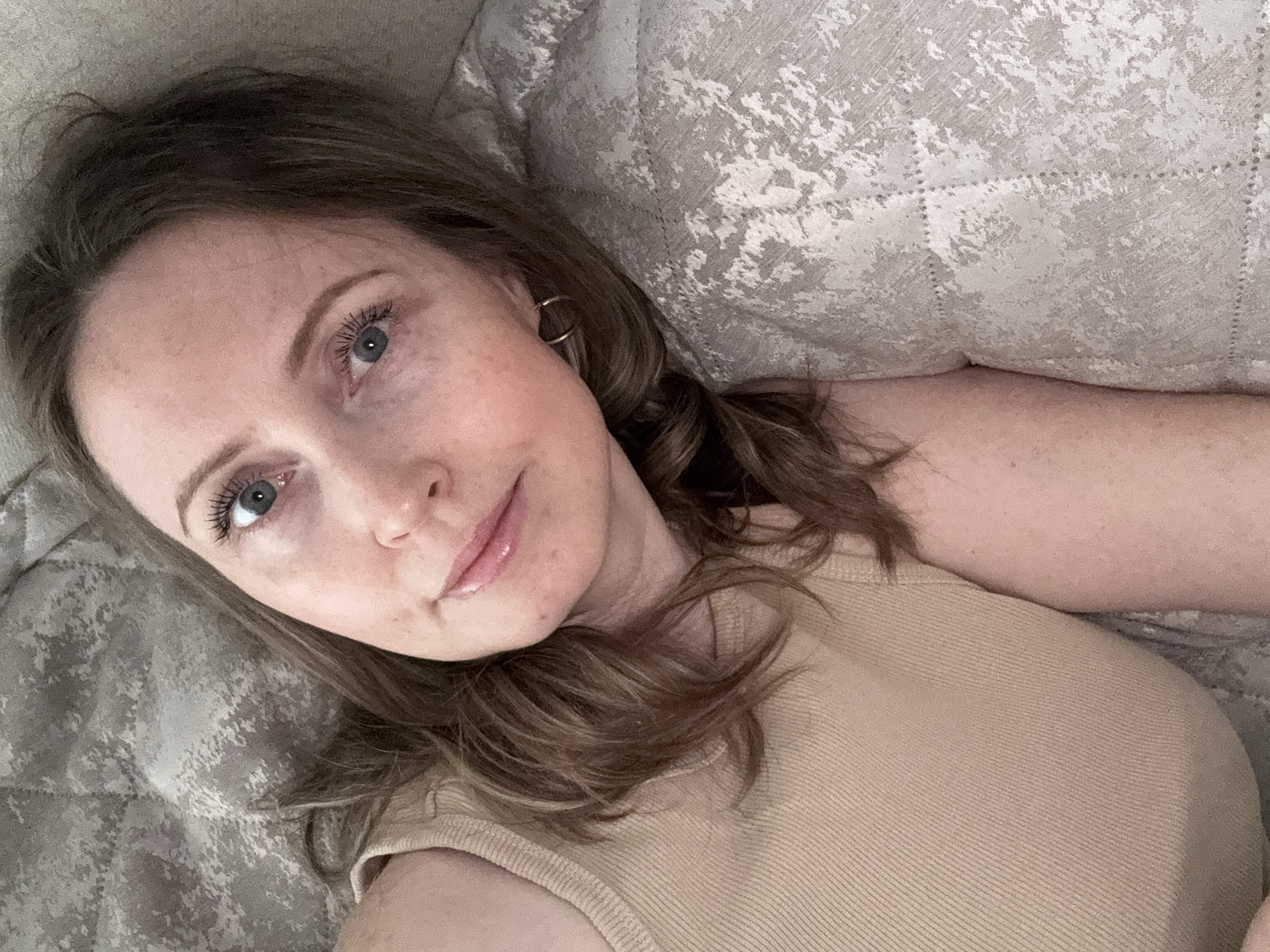 Woman observed resting indoors in Chaikovsky, Russia early morning