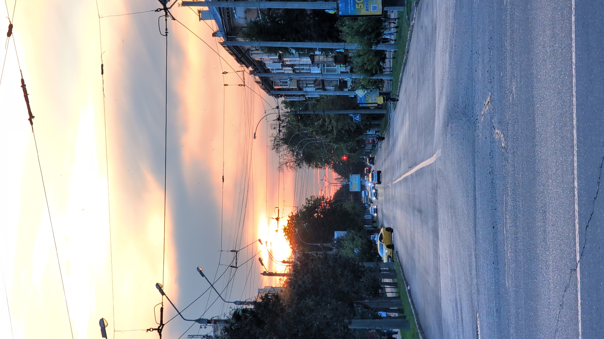 Summer evening street life in an Eastern European city at sunset