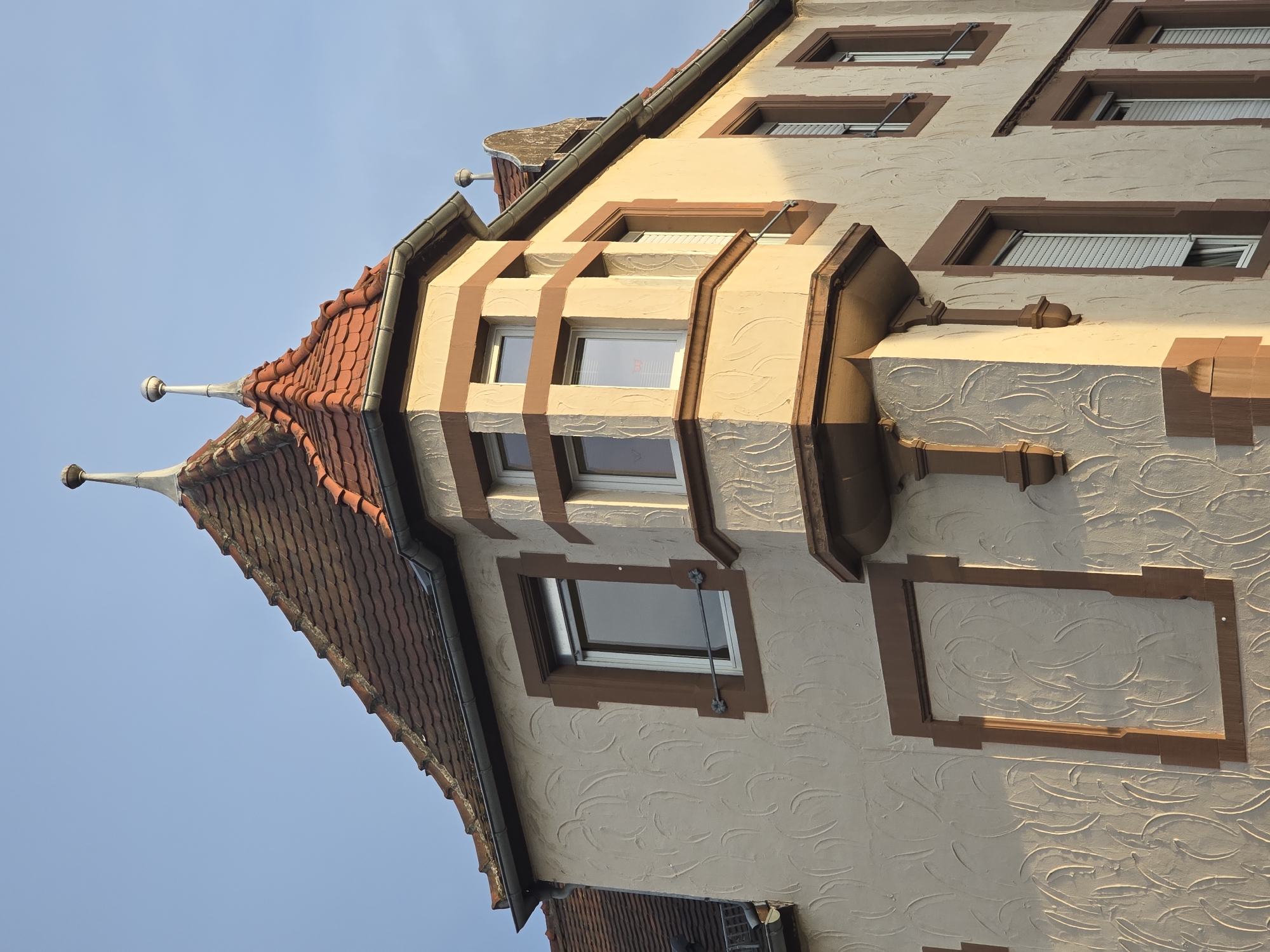 Cream and brown building corner in Worms, Germany
