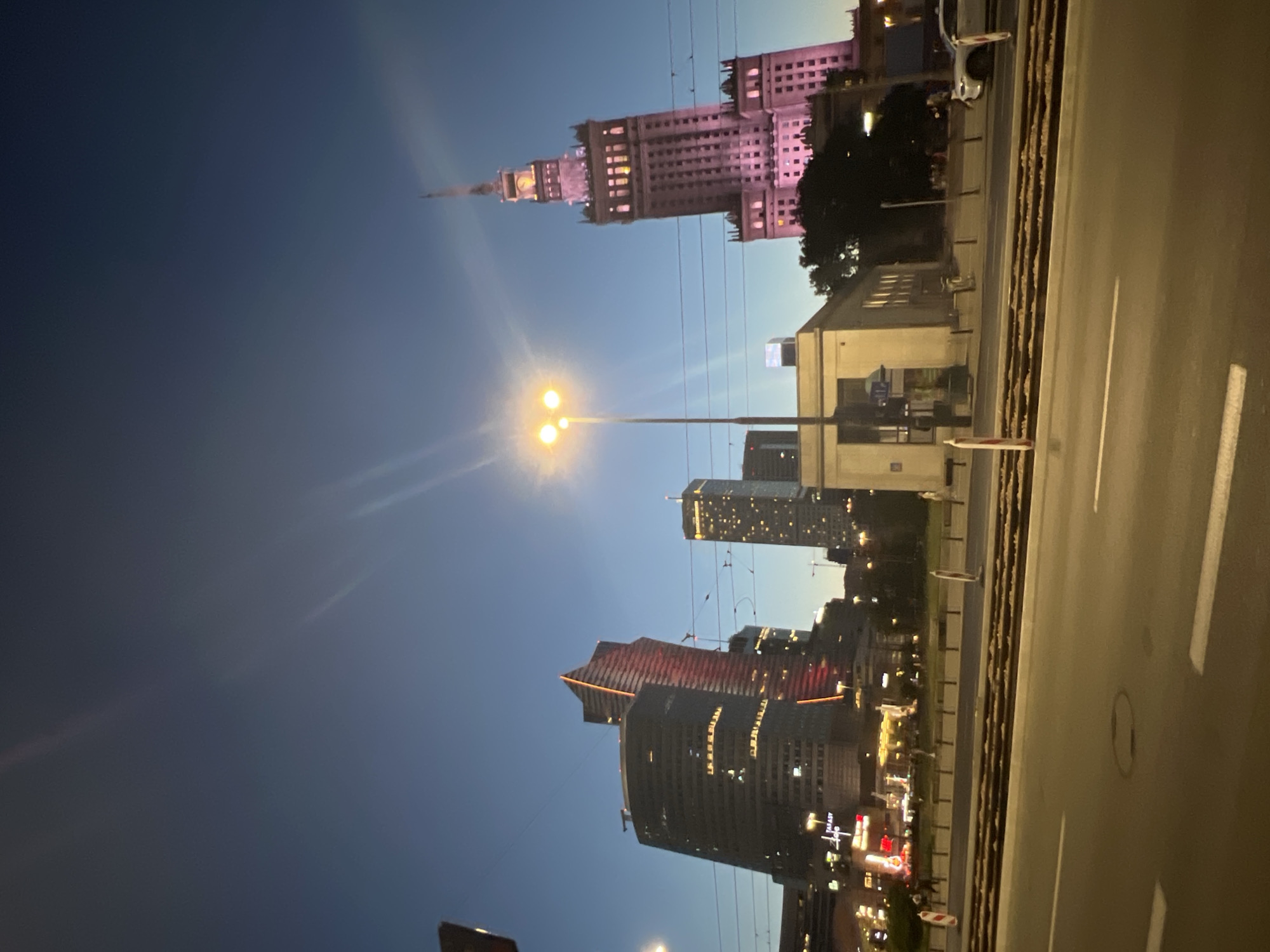 Warsaw city center at dusk, skyline and landmarks after sunset