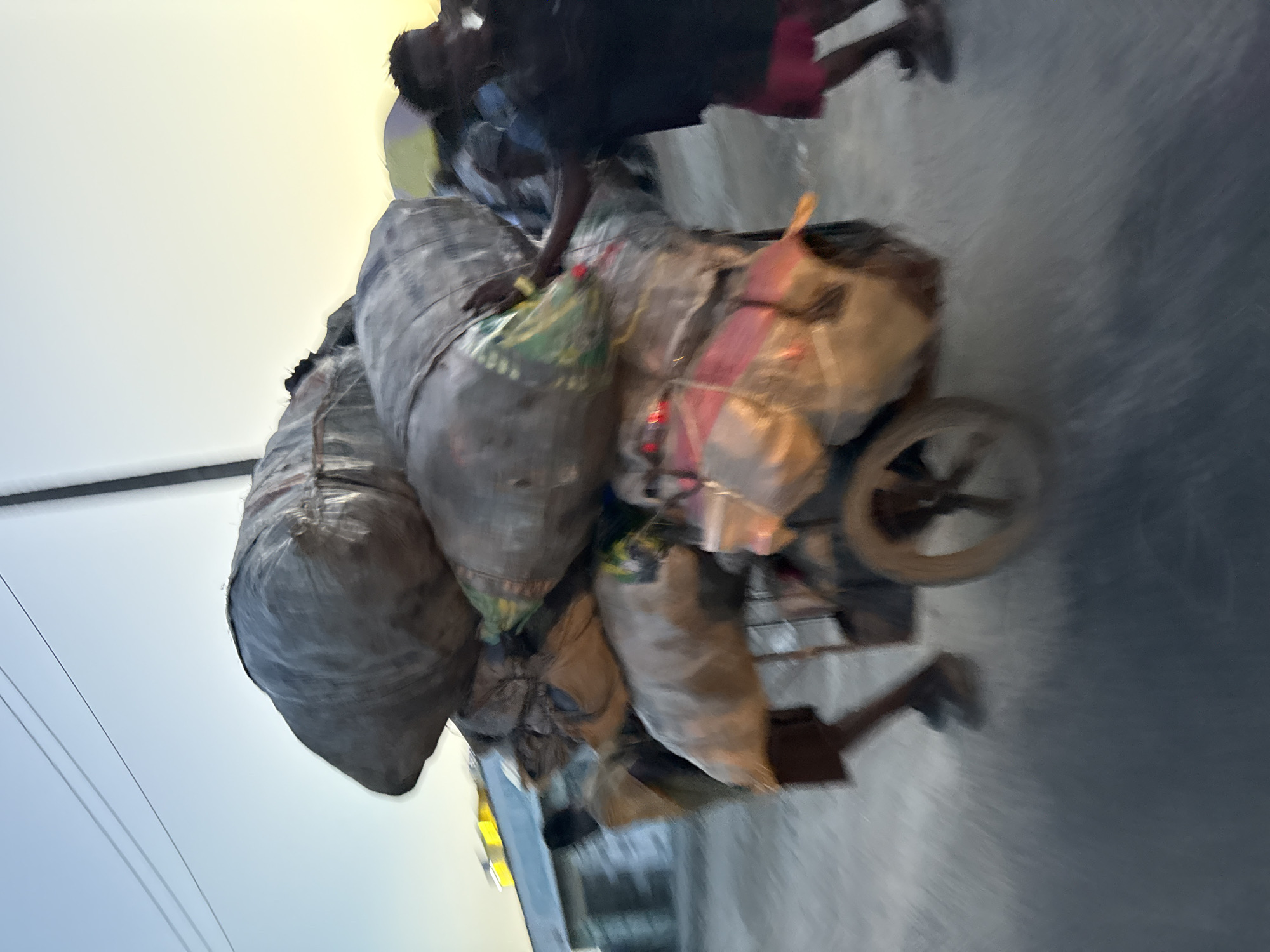 Heavy cargo cart rolling through the streets of Ado, Nigeria