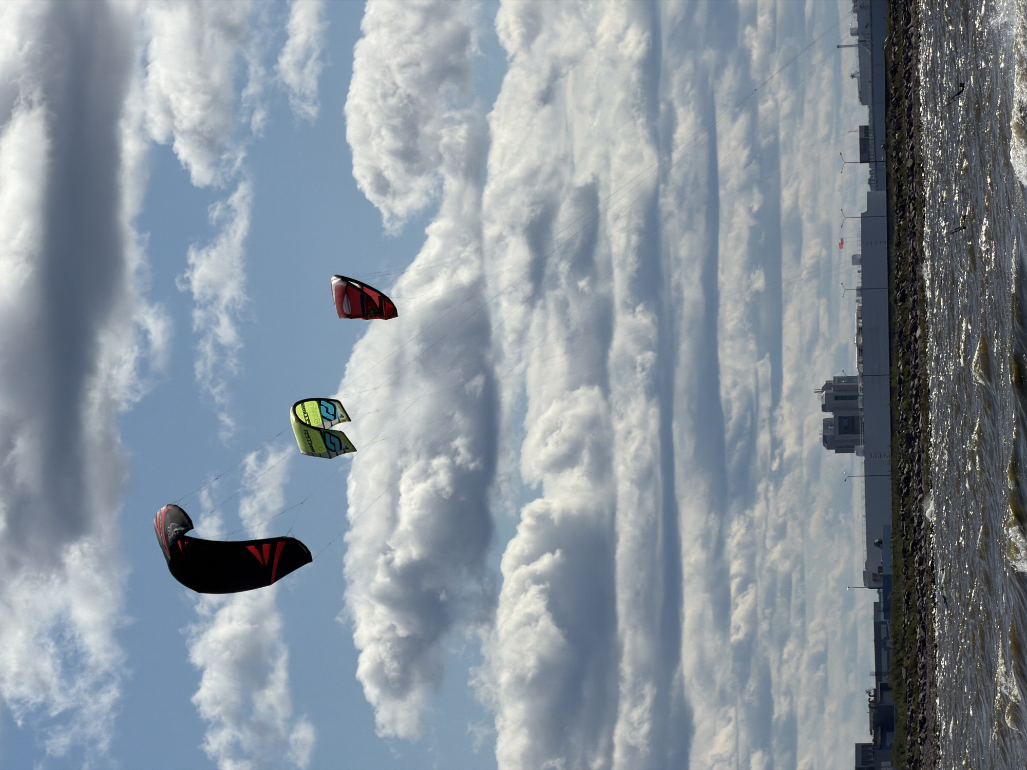 Kitesurfers catch air over the Gulf of Finland