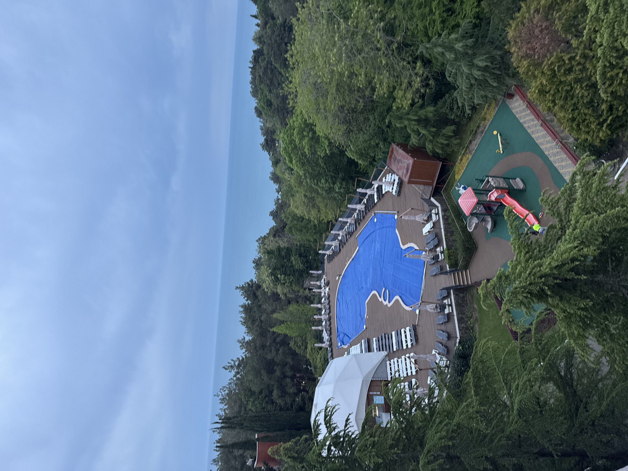 Resort pool and playground facility documented in Sosnovy, Russia