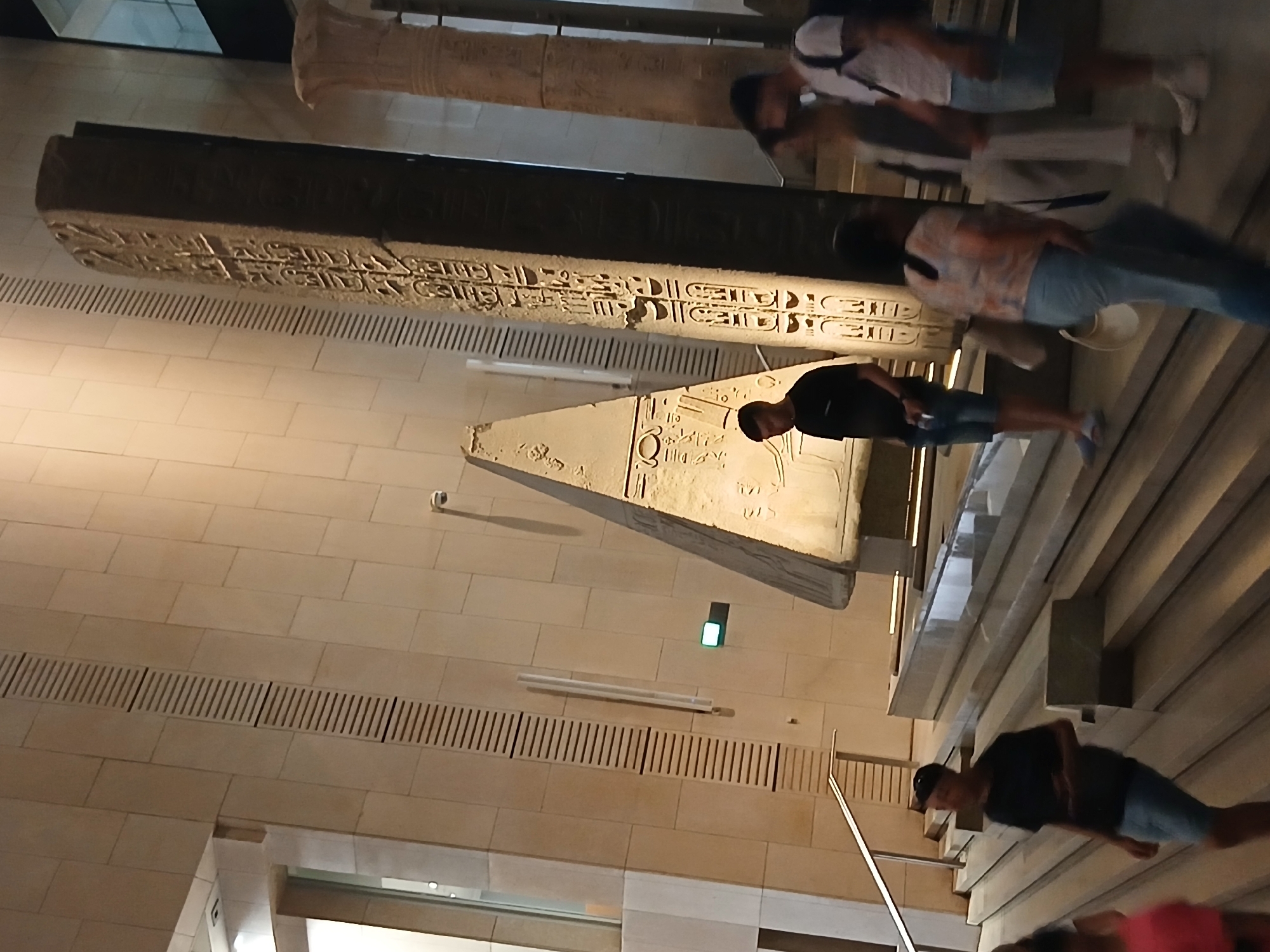 Visitors view Egyptian artifacts at Grand Museum in Giza