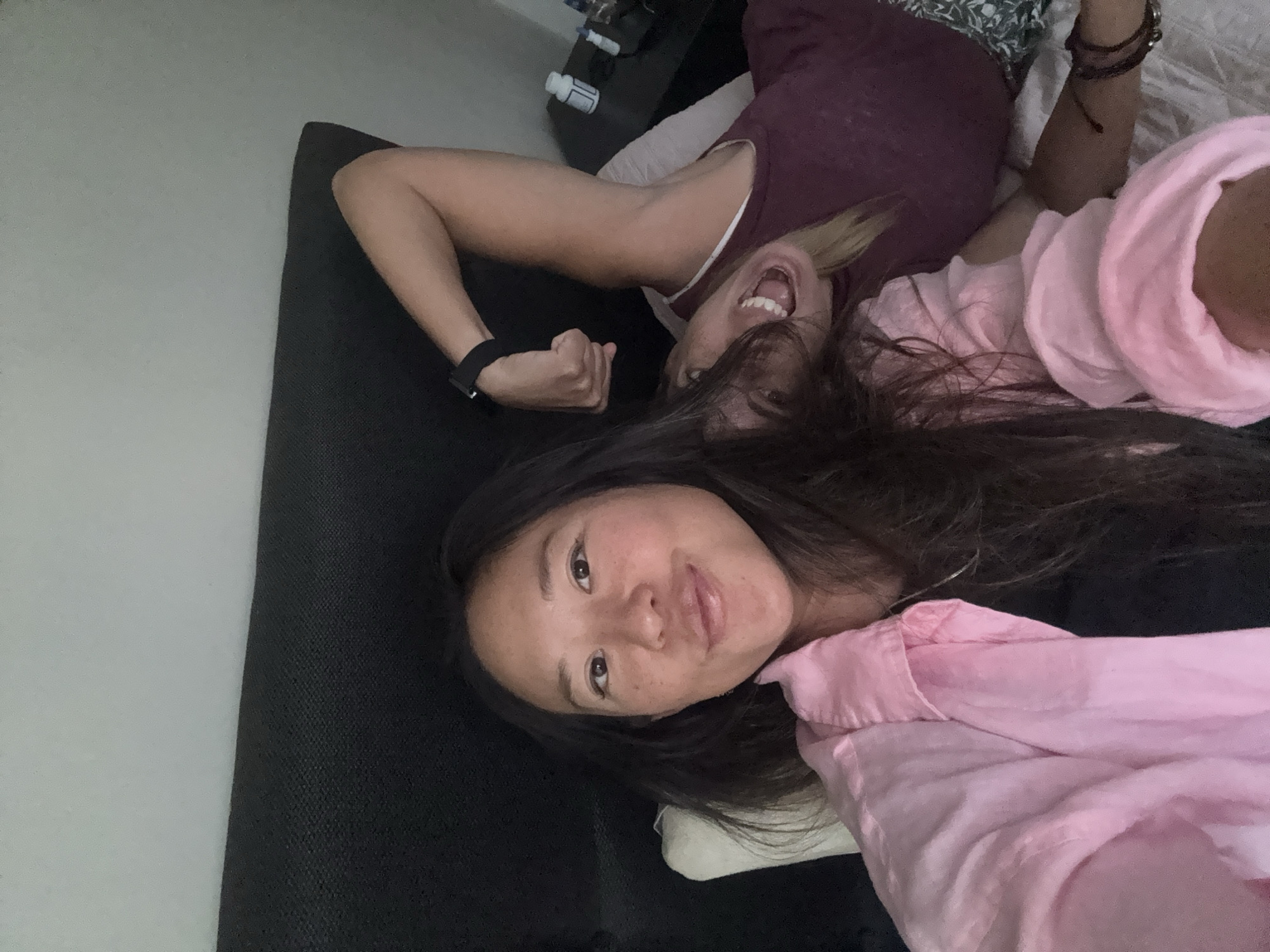Two women rest on couch in Miraflores