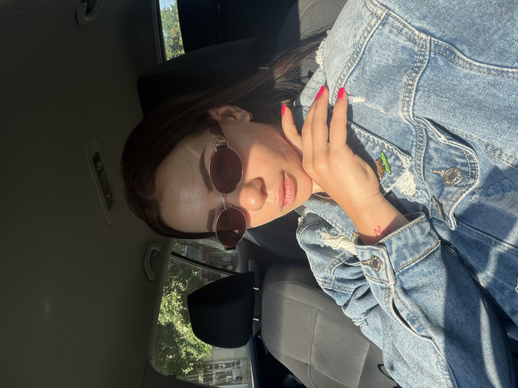 Woman plays with toy slot machine in car, Plovdiv