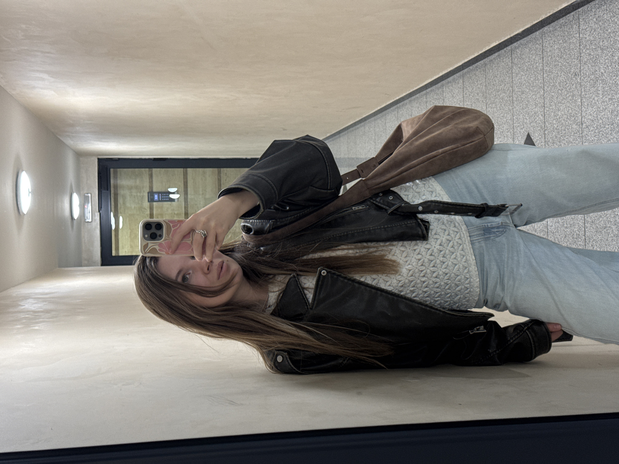 Woman Takes Mirror Selfie in Belgrade Public Space