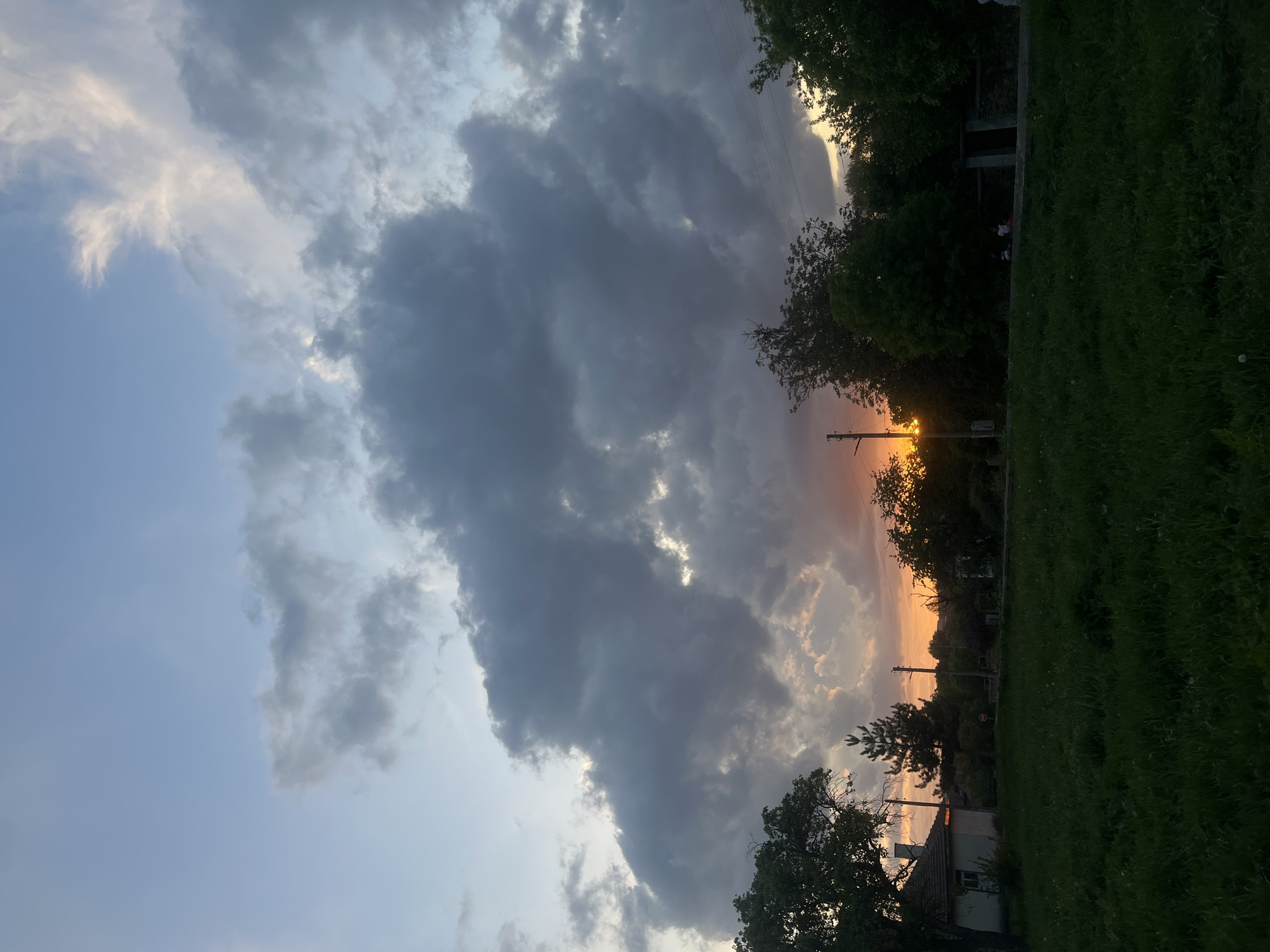 Woman walks through Bulgarian village at dramatic sunset