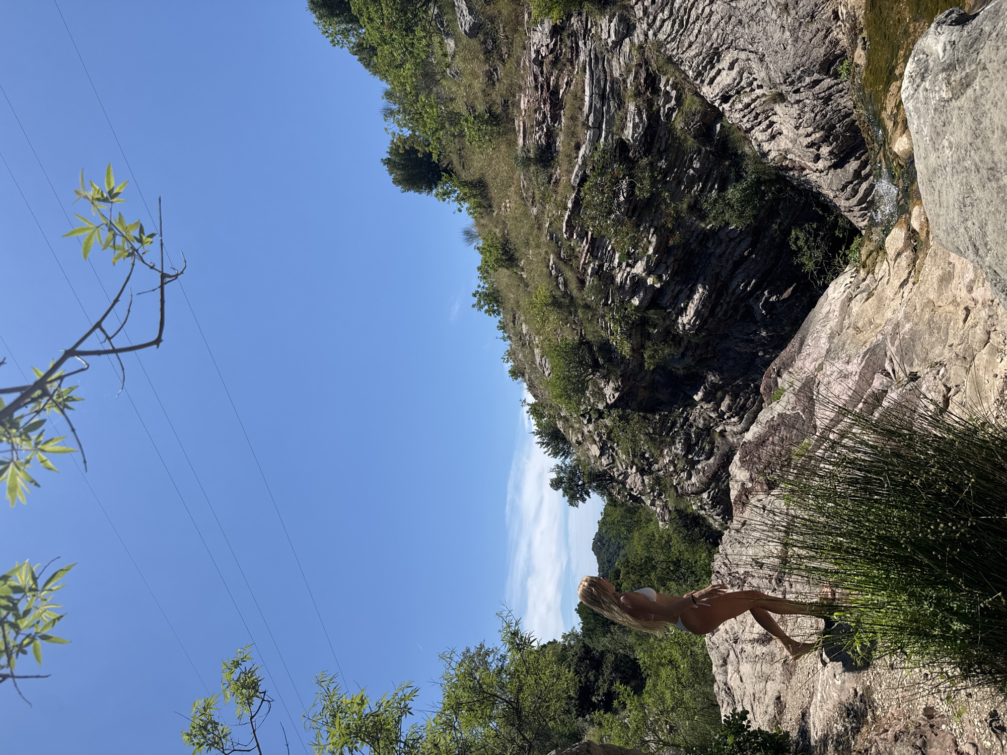 Waterfall gorge and a purple Mercedes on Montenegro's coast
