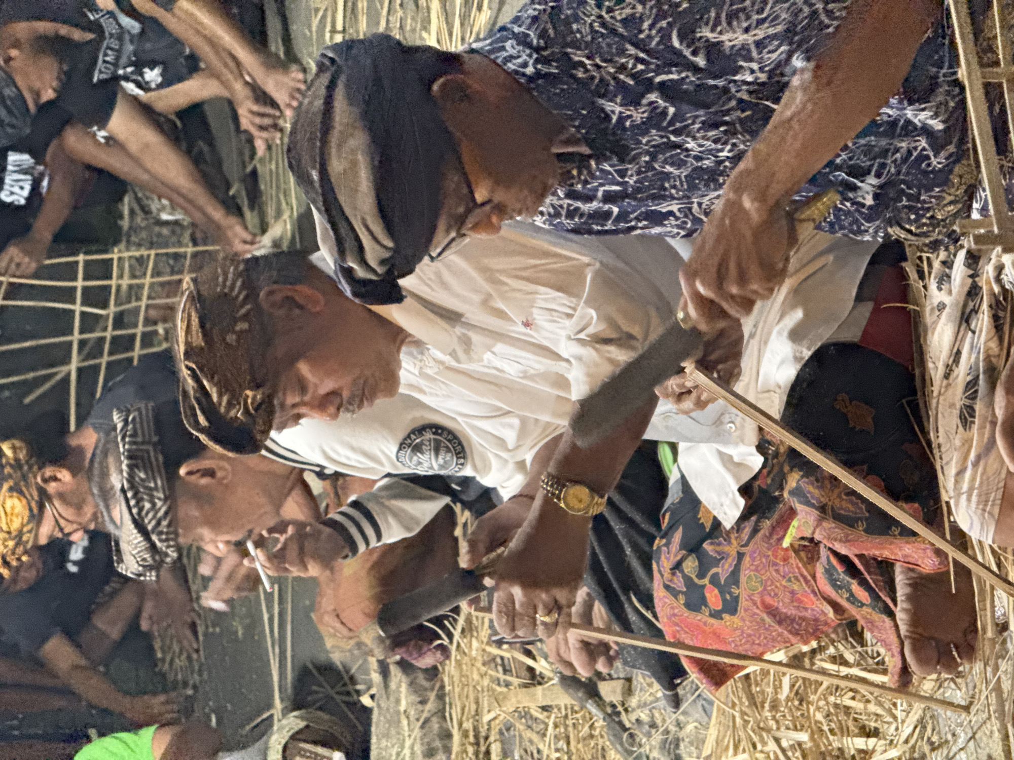 Ubud community gathers at night for ceremonial preparations