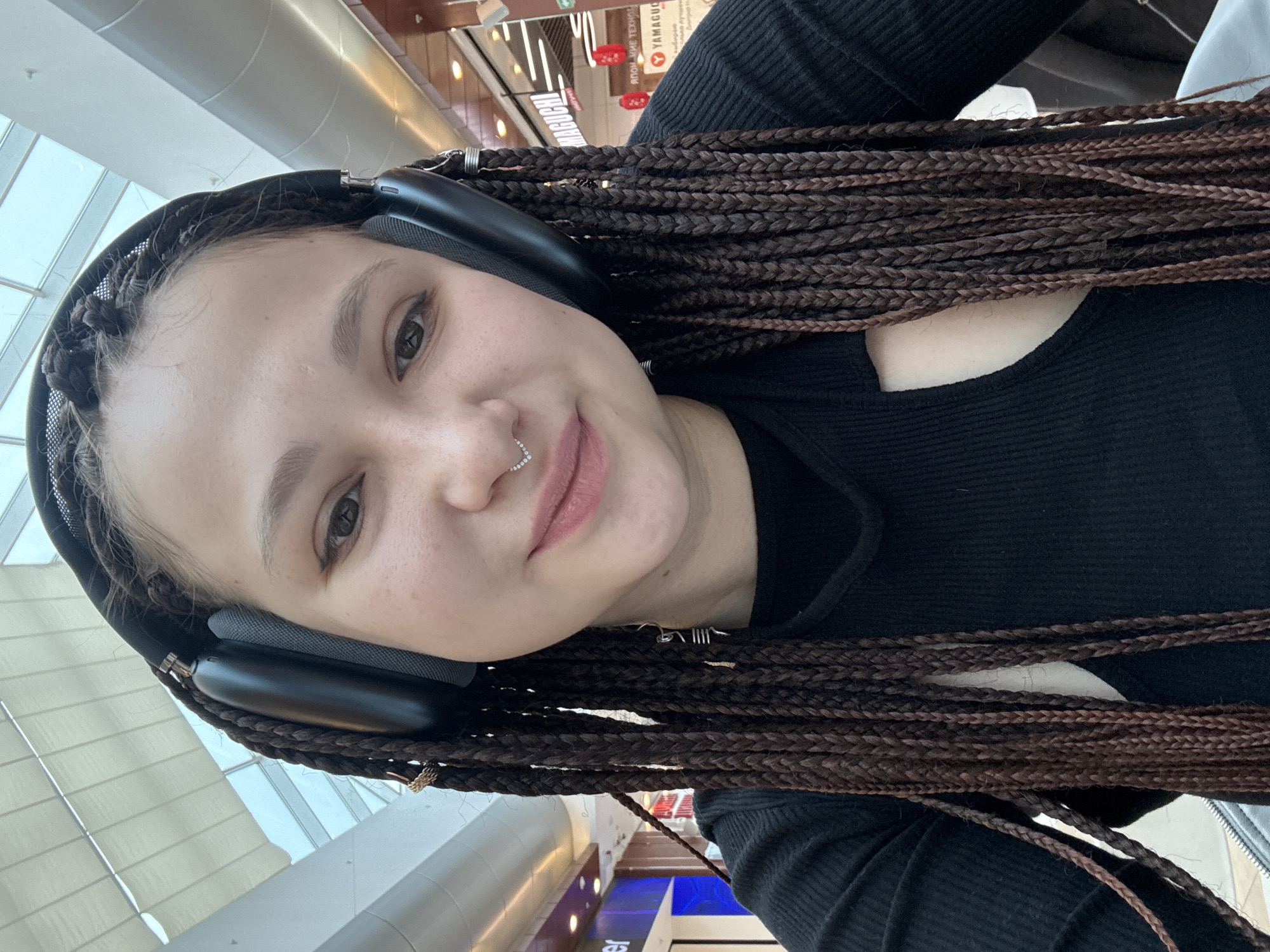 Woman takes selfie in indoor public space in Saratov