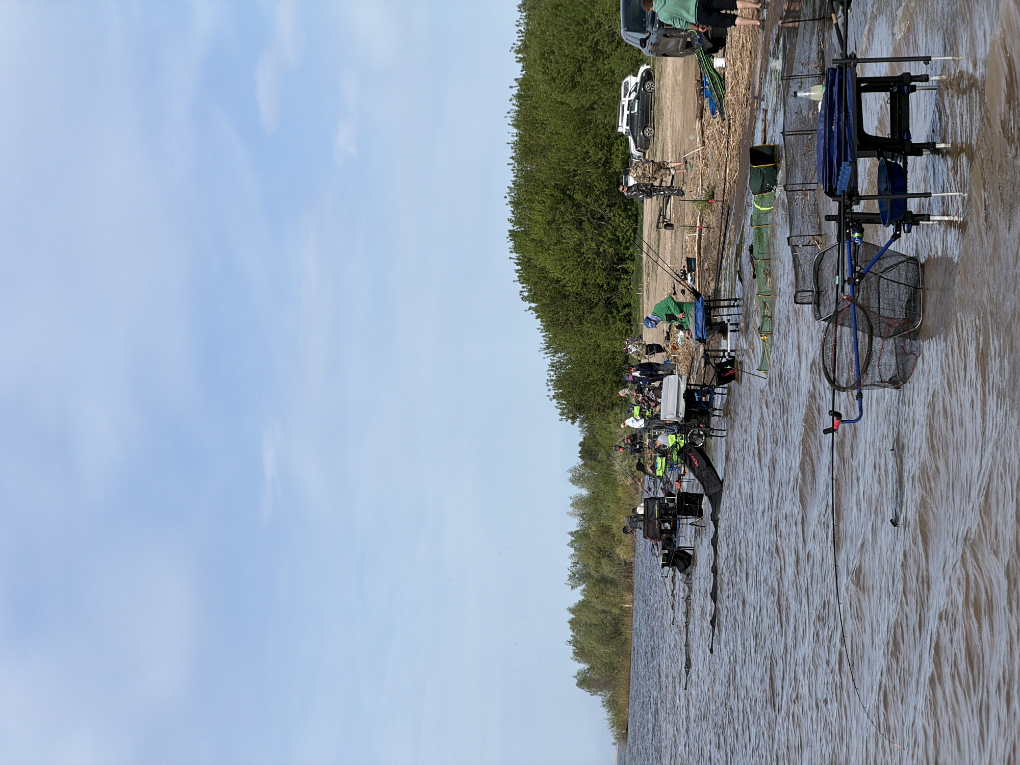 Early morning fishing group gathers at Krasnyi Bor lakeside