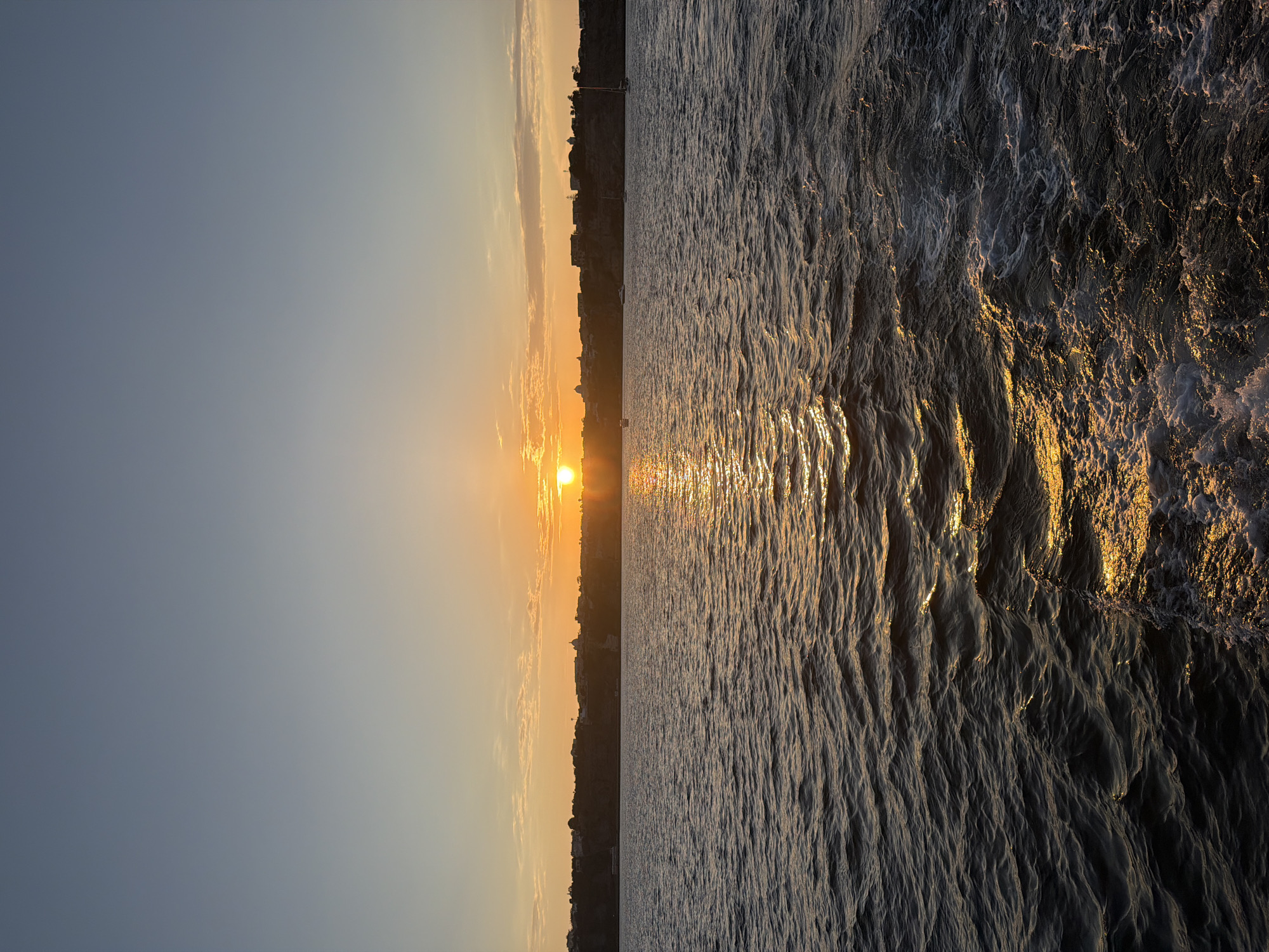 Sunset and coastal views captured from sea near Procida