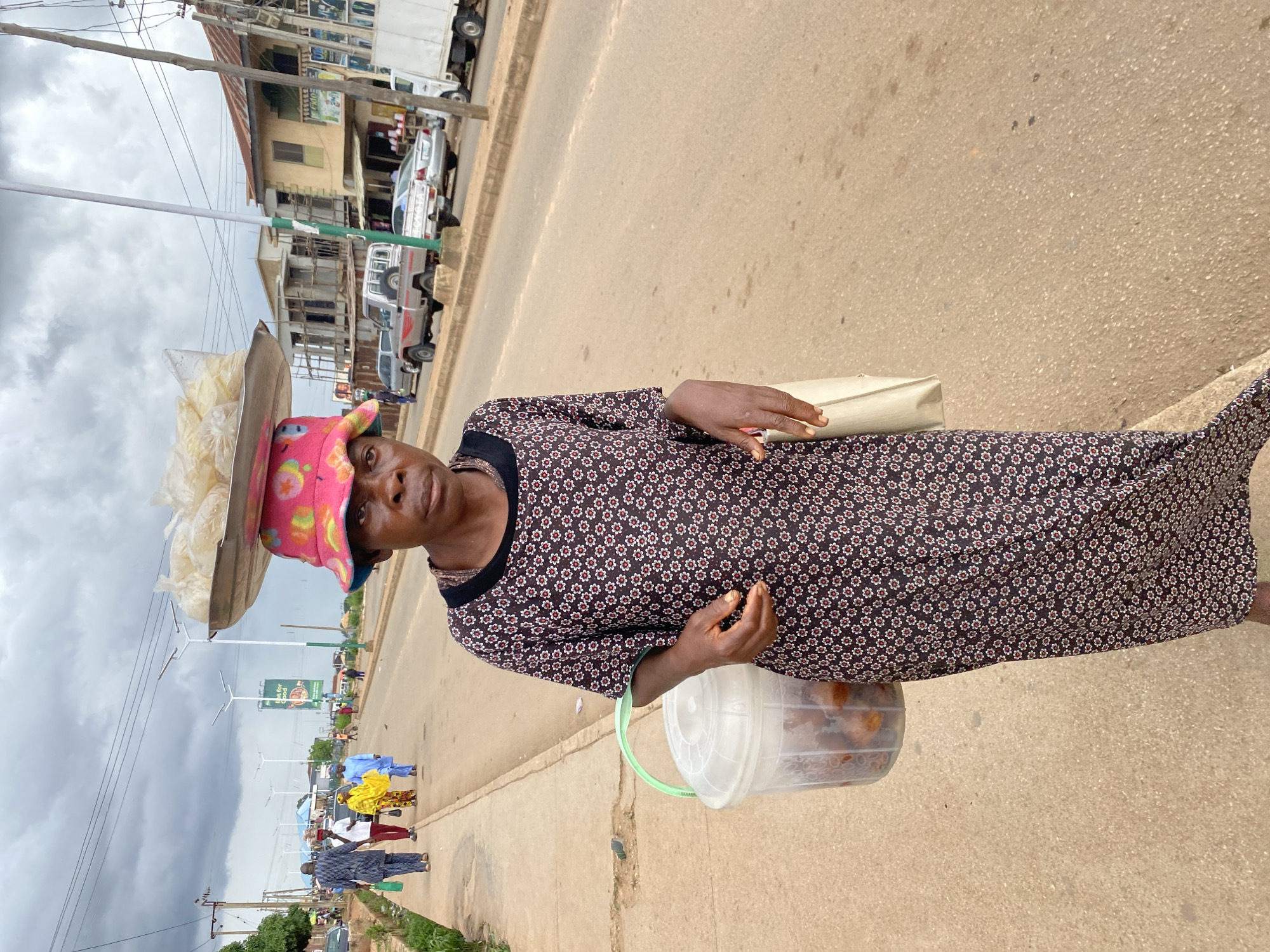 Busy street commerce and foot traffic in Bukuru, Nigeria