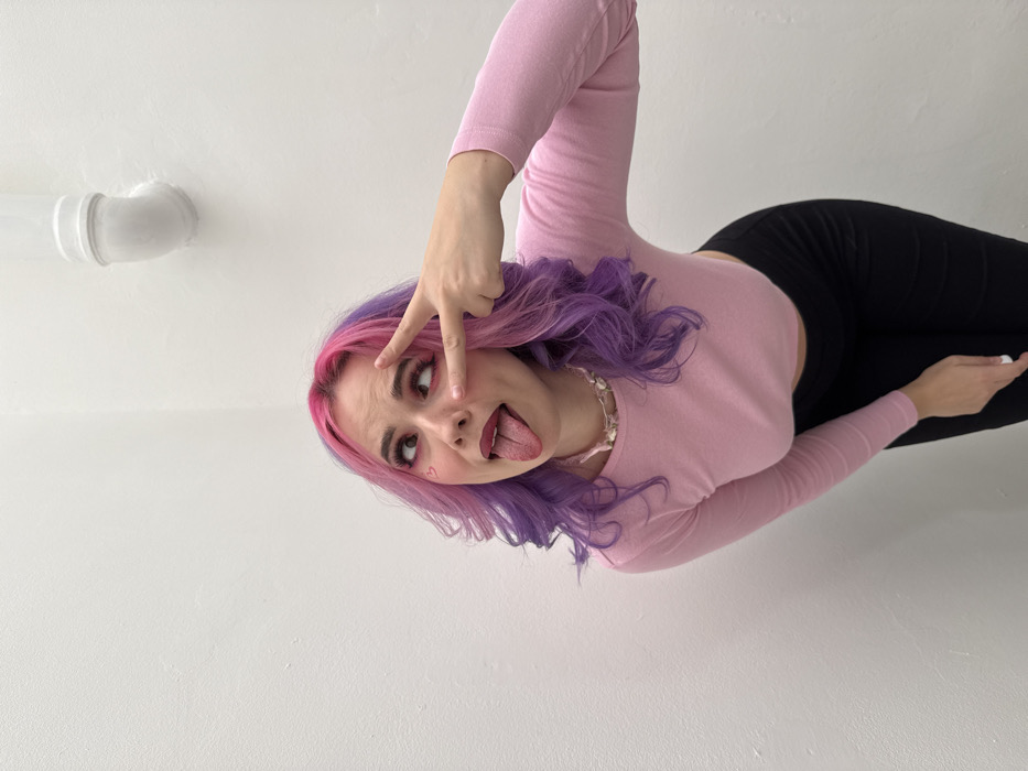 Pink-purple haired woman poses throughout Zagreb on Valentine's Day
