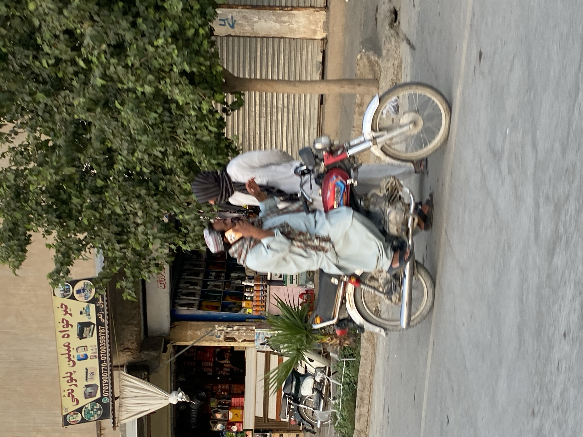 Everyday street traffic and commerce in Kandahar