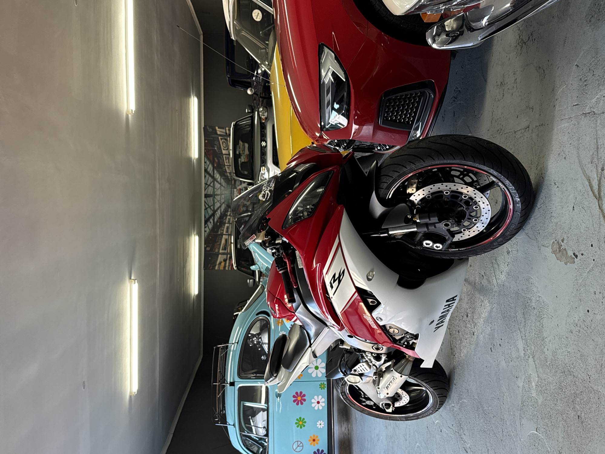 Red and white Yamaha R6 parked indoors, Cape Town garage