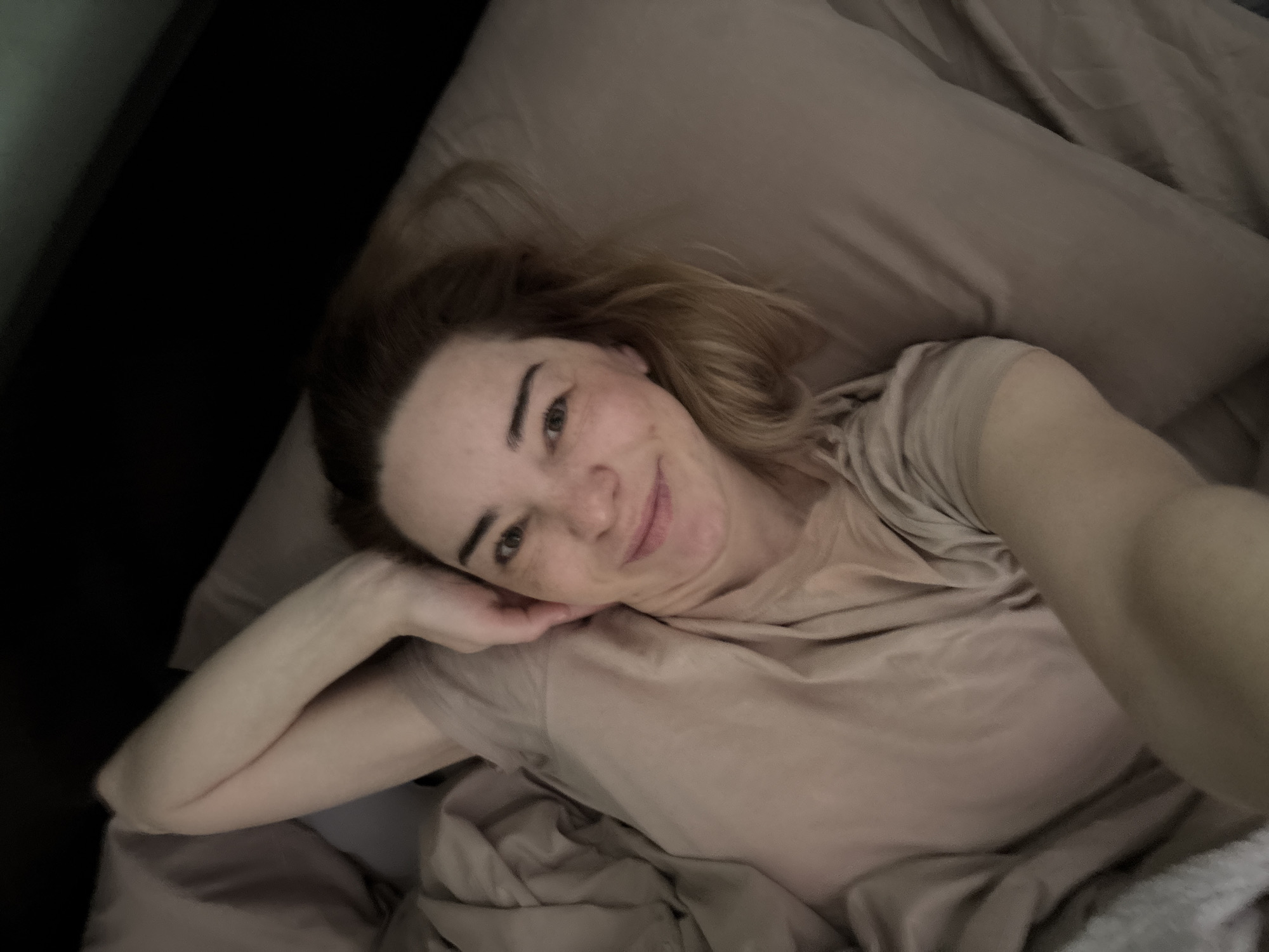 Person documented in medical setting and bedroom, Russia